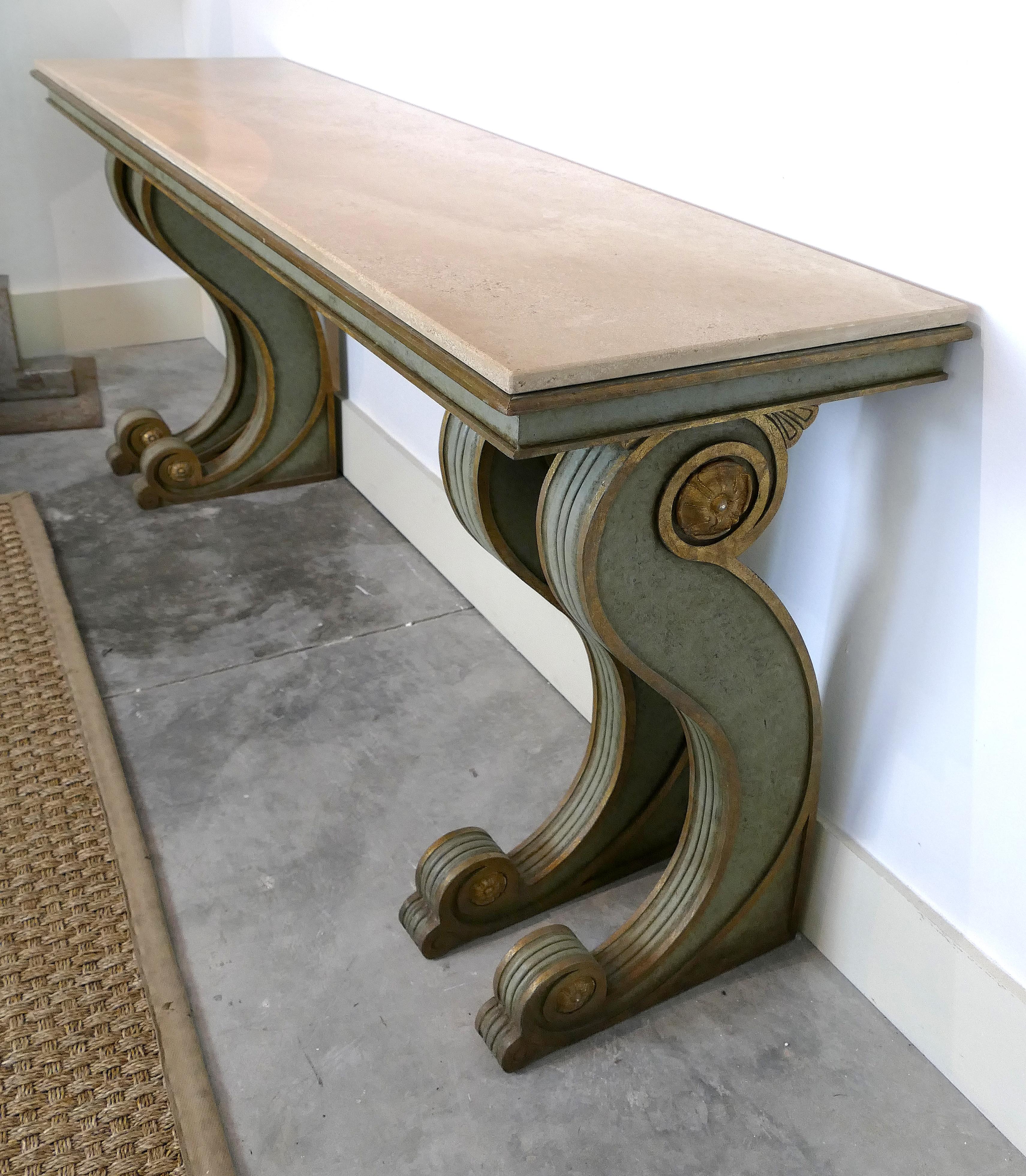 Niermann Weeks neoclassical style console with a Travertine top

Offered for sale is an Impressive overscaled neoclassical style console by Niermann Weeks. This substantial hand carved wooden console is an example of fine quality craftsmanship.