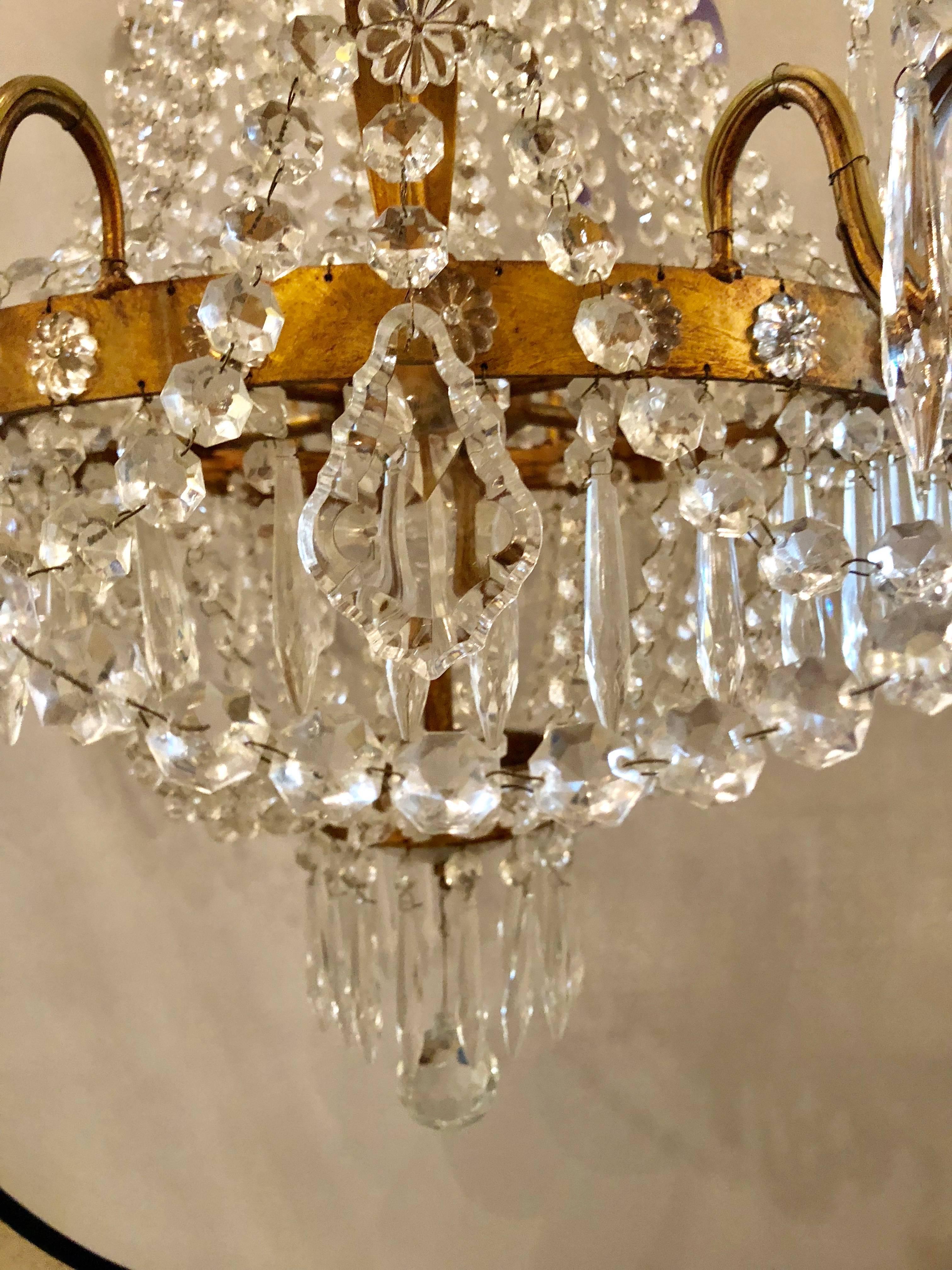 A Niermann Weeks Original Campaign Chandelier. This finely cast metal and crystal chandelier by Weeks (Item # 10-04799-41-12) was purchased by the present owner in the 1990s and has been give to us as a consignment at less than 50 percent off of the