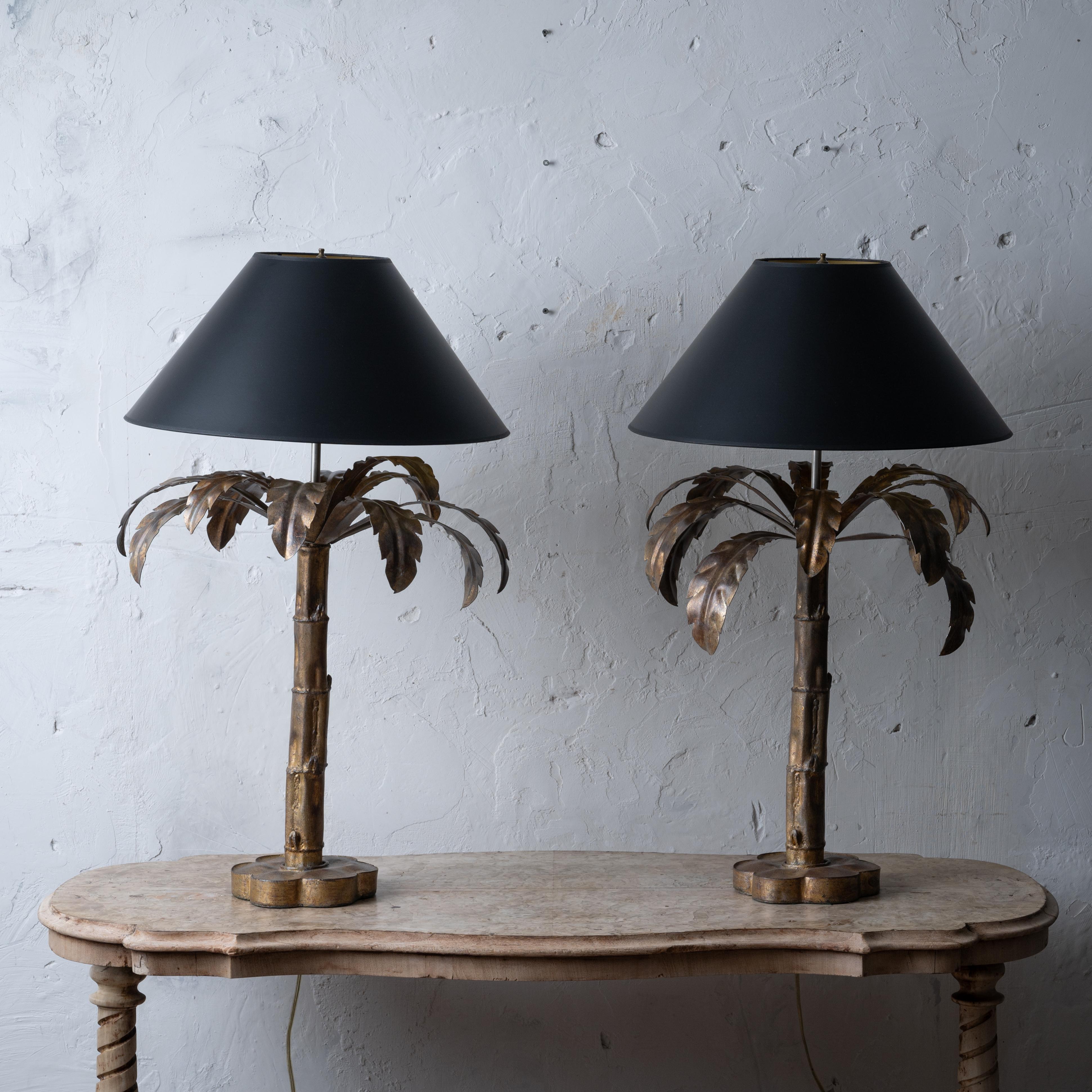 A pair of Niermann Weeks palm tree table lamps with shades, late 20th century. 

20 inches wide by 34 inches tall

