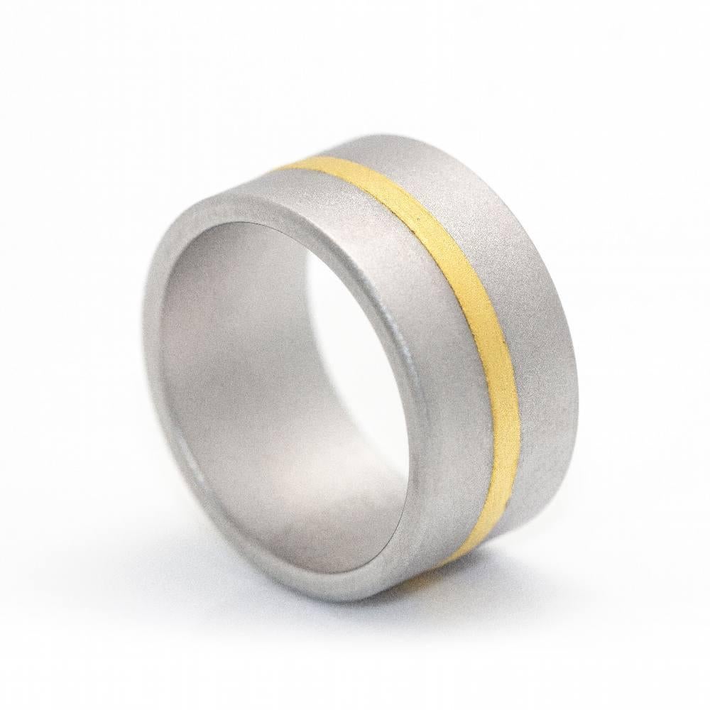 NIESSING Steel and Yellow Gold Ring for women l Measurements: Width 10mm and Thickness 1,5mm l Size 14, this ring cannot be resized  24 kt Yellow Gold and special sandblasted Steel Alloy  8,60 grams  Brand new item  Ref.: D359990JC