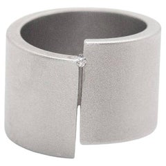 Bague NIESSING en acier et diamant