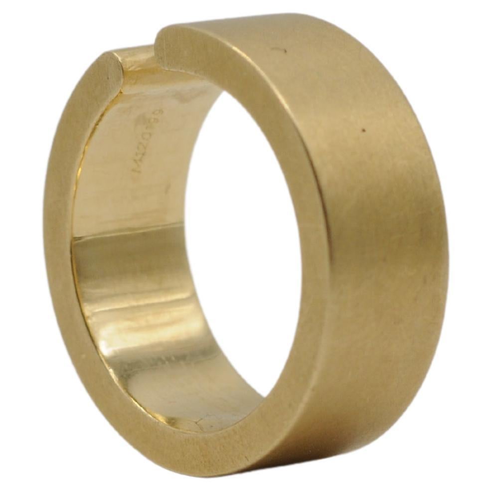 Women's or Men's Niessing tension ring in 18k yellow gold with a brilliant For Sale