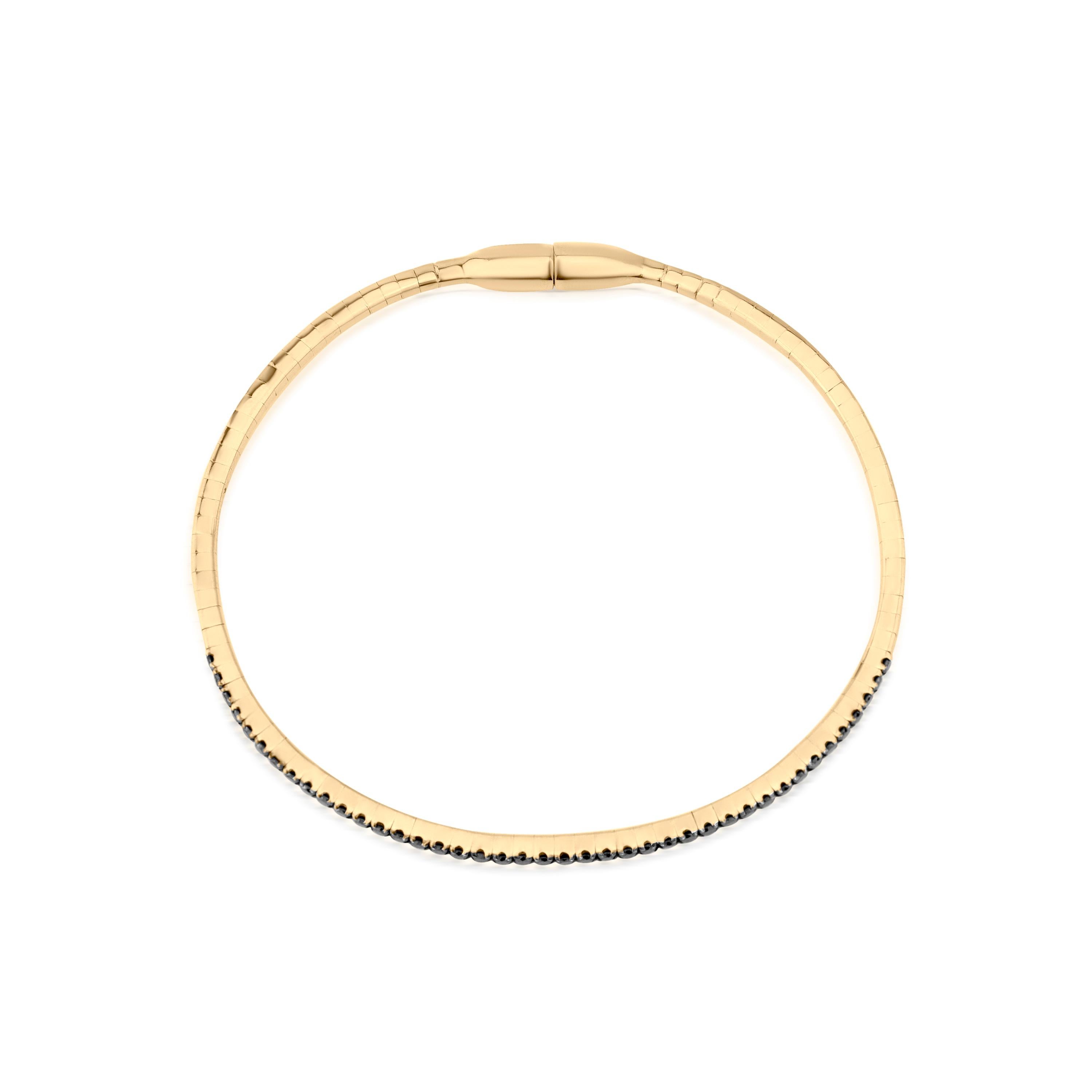 Add a touch of bold sophistication to your style with this stunning 0.58 Cttw Black Diamond Bangle. Crafted in luxurious 18K two-tone gold, this sleek bangle showcases a striking row of round, full-cut black diamonds, each securely set in prong