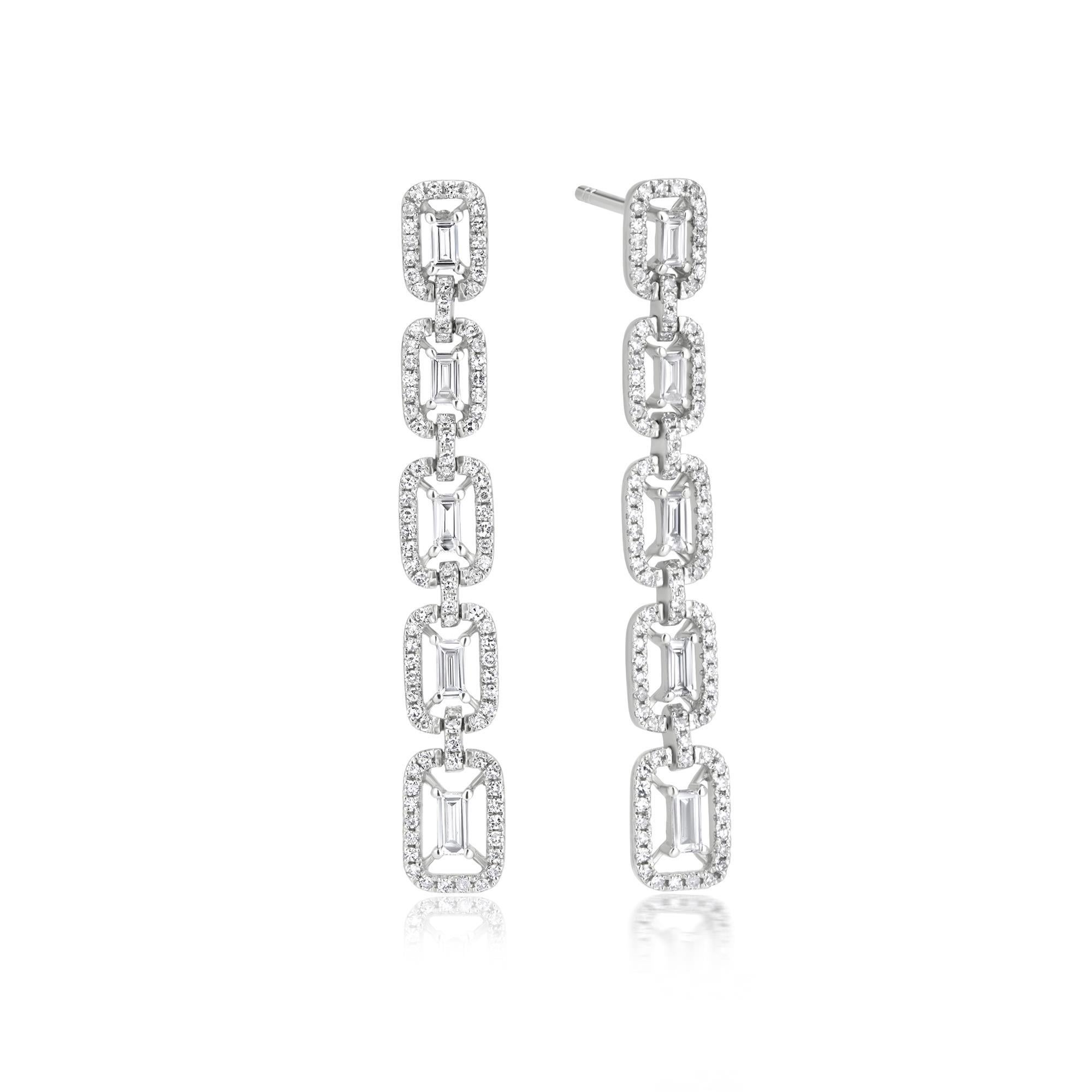 Elevate your style with these exquisite diamond drop earrings. Crafted in 14K white gold, these earrings showcase a cascading design featuring baguette and round diamonds set in prongs, meticulously set in a halo style. The combination of diamond