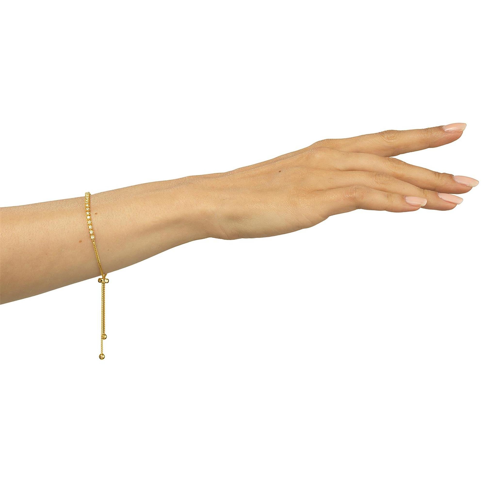Elevate your wrist with this exquisite Diamond Bolo Bracelet. Crafted with shimmering  diamonds set in a sleek 18K yellow gold chain, this bracelet exudes timeless elegance and sophistication and features a delicate chain adorned with round