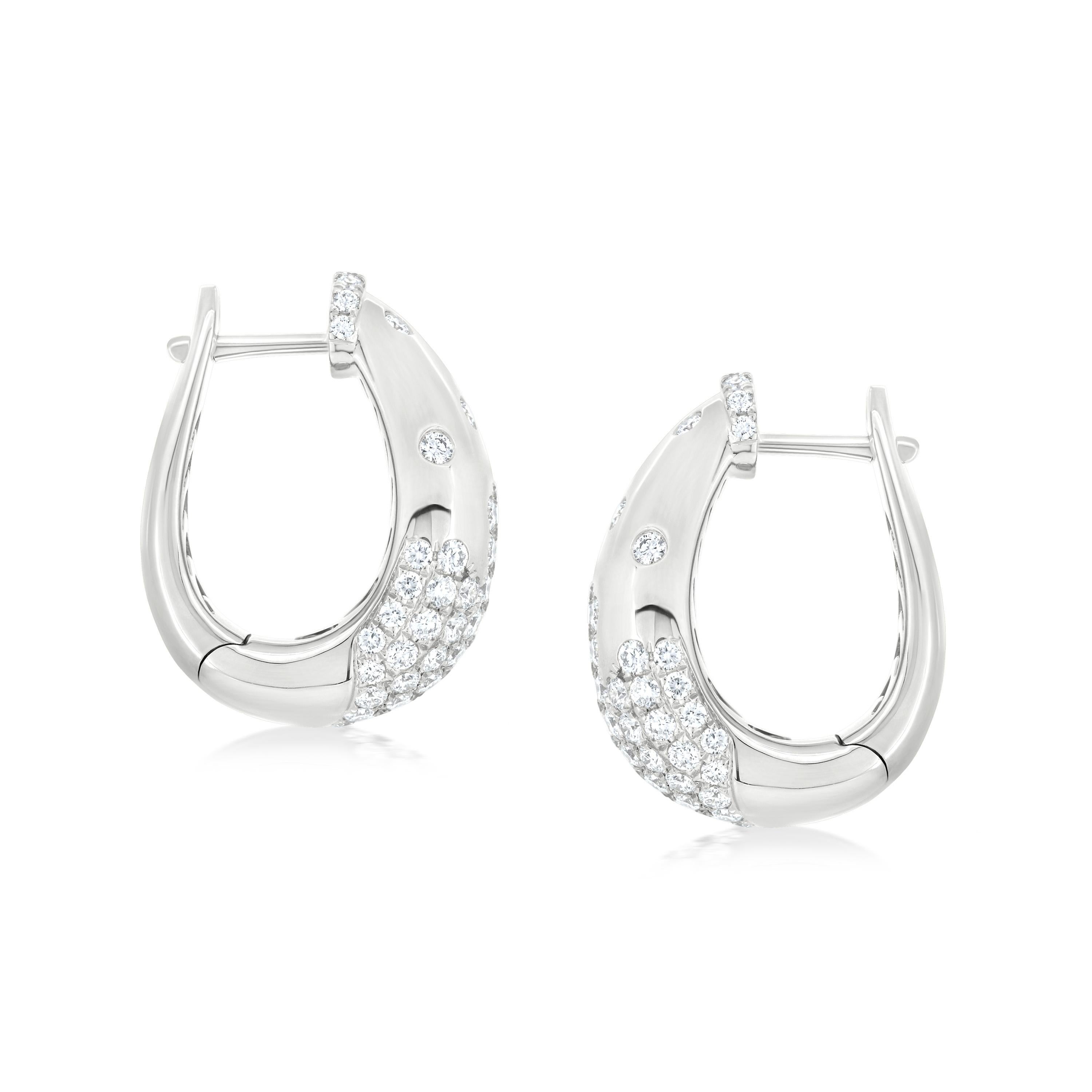 Embrace understated elegance with these exquisite Serpens Diamond Hoop Earrings. Crafted in lustrous 18K white gold, these earrings feature a sleek, contemporary design that effortlessly elevates any ensemble.

Each earring showcases a captivating