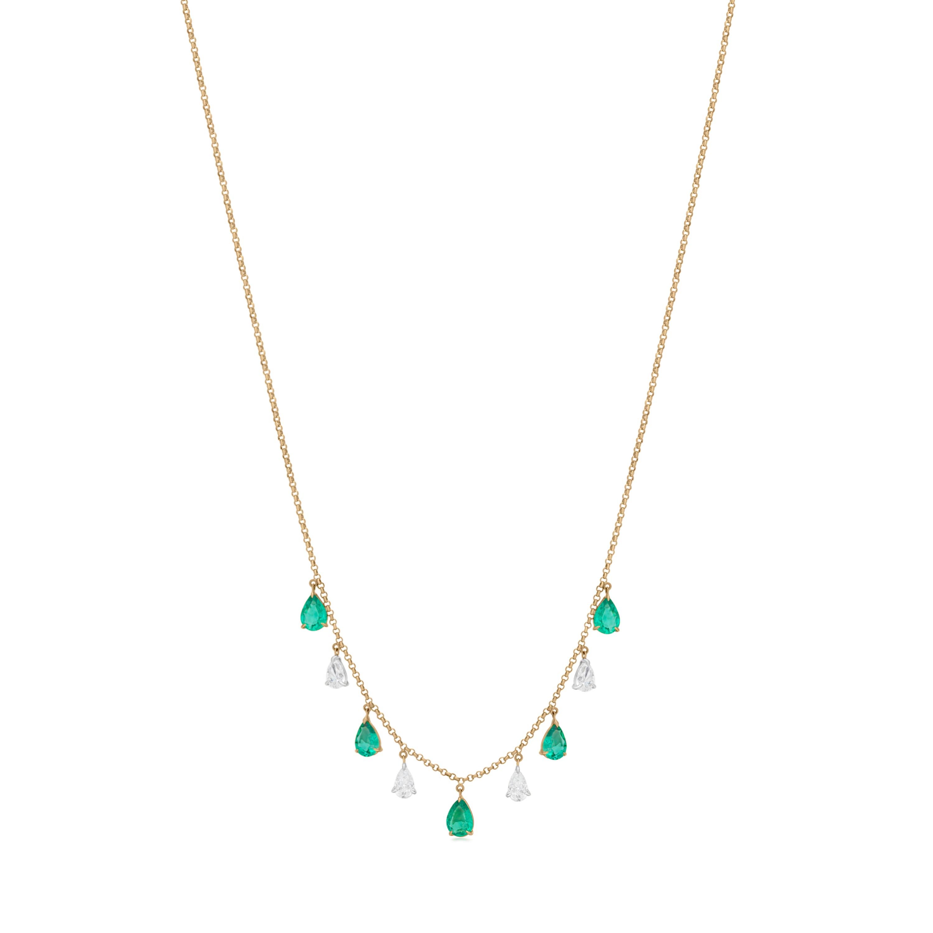 This Nigaam Pear Emerald and Diamond Drop Necklace in 18K Yellow Gold features alternating drops of 2.46 carats pear emerald and 1 carts pear diamond drops hanging from a rolo chain of 18k Yellow gold. This 18