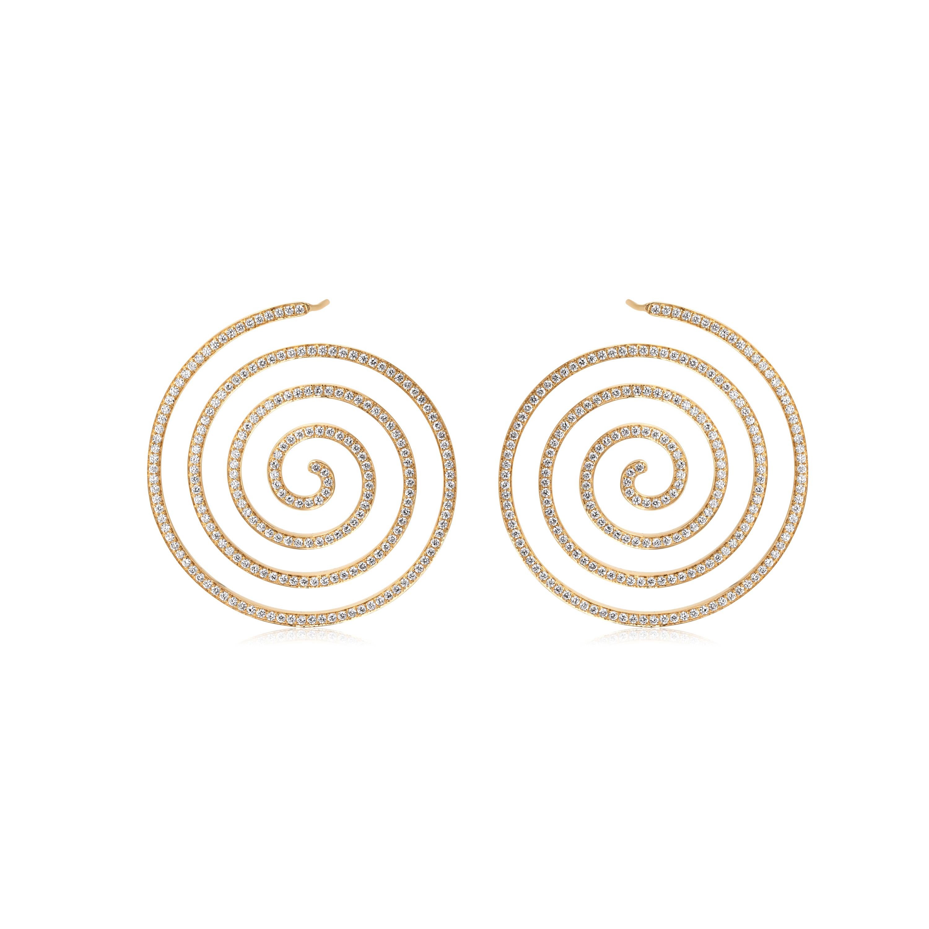 This Nigaam concentrically coiled stud earring pair has round full-cut white diamonds on an 18K Yellow Gold body. The diamonds are SI1 in clarity and GH in color. The diamonds weigh 3.62 Cts. Glam up your daily look with this stylish pair of stud