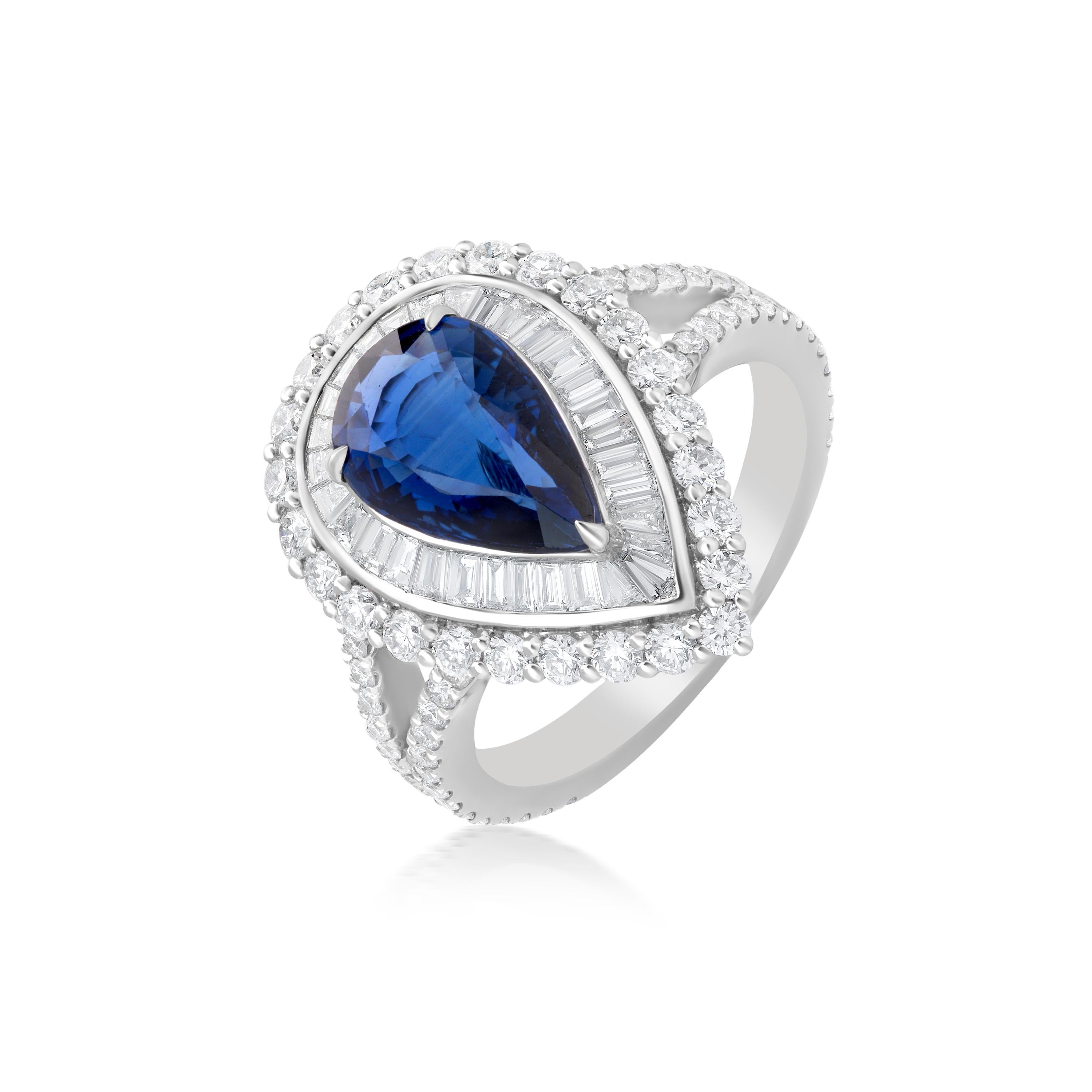 A pear shape Blue and white gold is a glamorous style that ticks off two trends in one ! This design from Nigaam is also adorned with a double halo of Baguette and round diamonds and a split shank of glittering diamonds giving it a magnificent