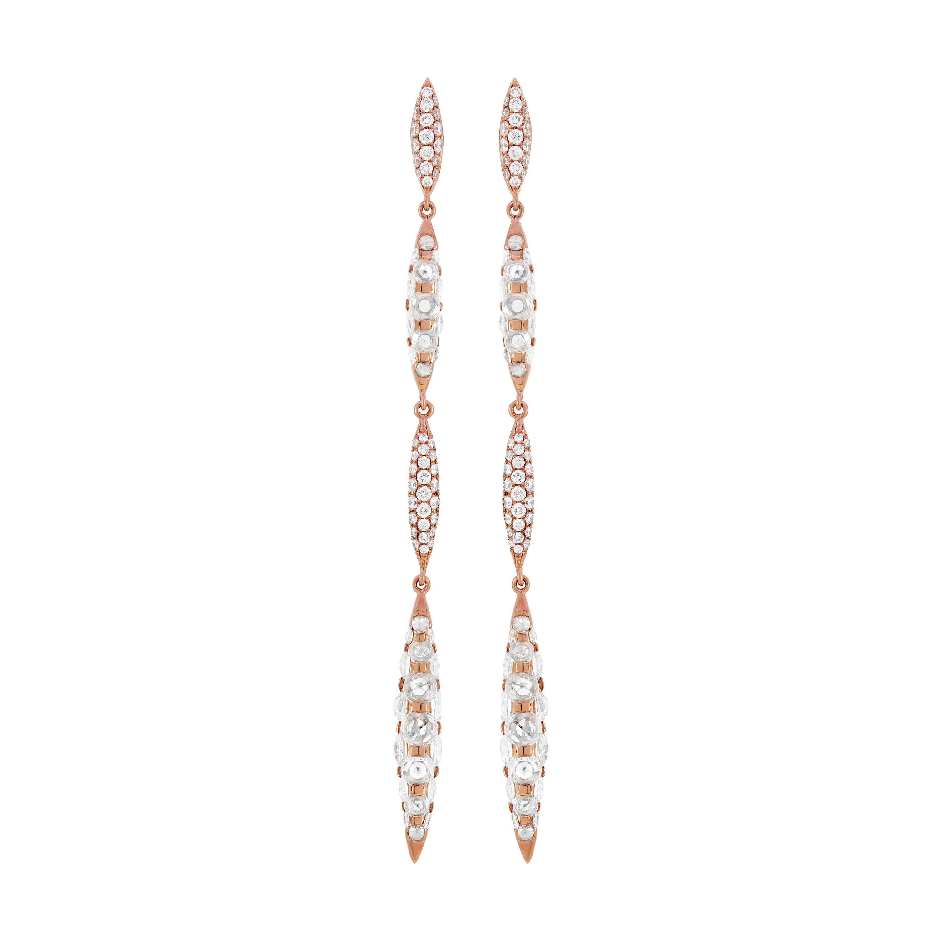 Add a touch of elegance to your jewelry collection with the Nigaam 4.51 Cttw. Round Rose-Cut Diamond Dangle Earrings in 18K Rose Gold. These earrings are a true work of art, combining classic design with modern styling to create a unique and