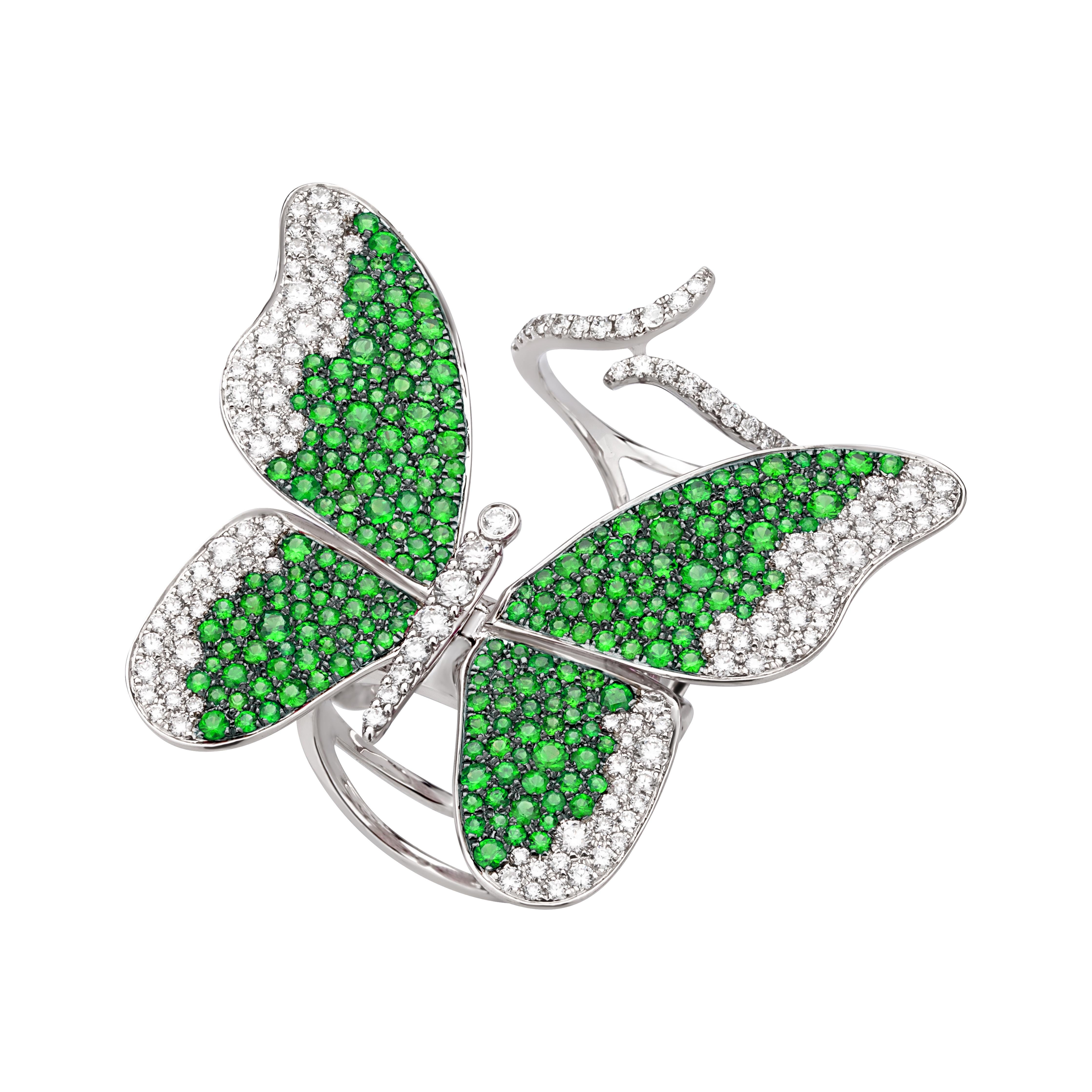 The top-view of this Nigaam stretch ring looks like a butterfly which features round full-cut White Diamonds in a micro pave, bezel, and prong setting on the edges of the wings. Some bright and sparkling Tsavorite stones set in a prong makes the