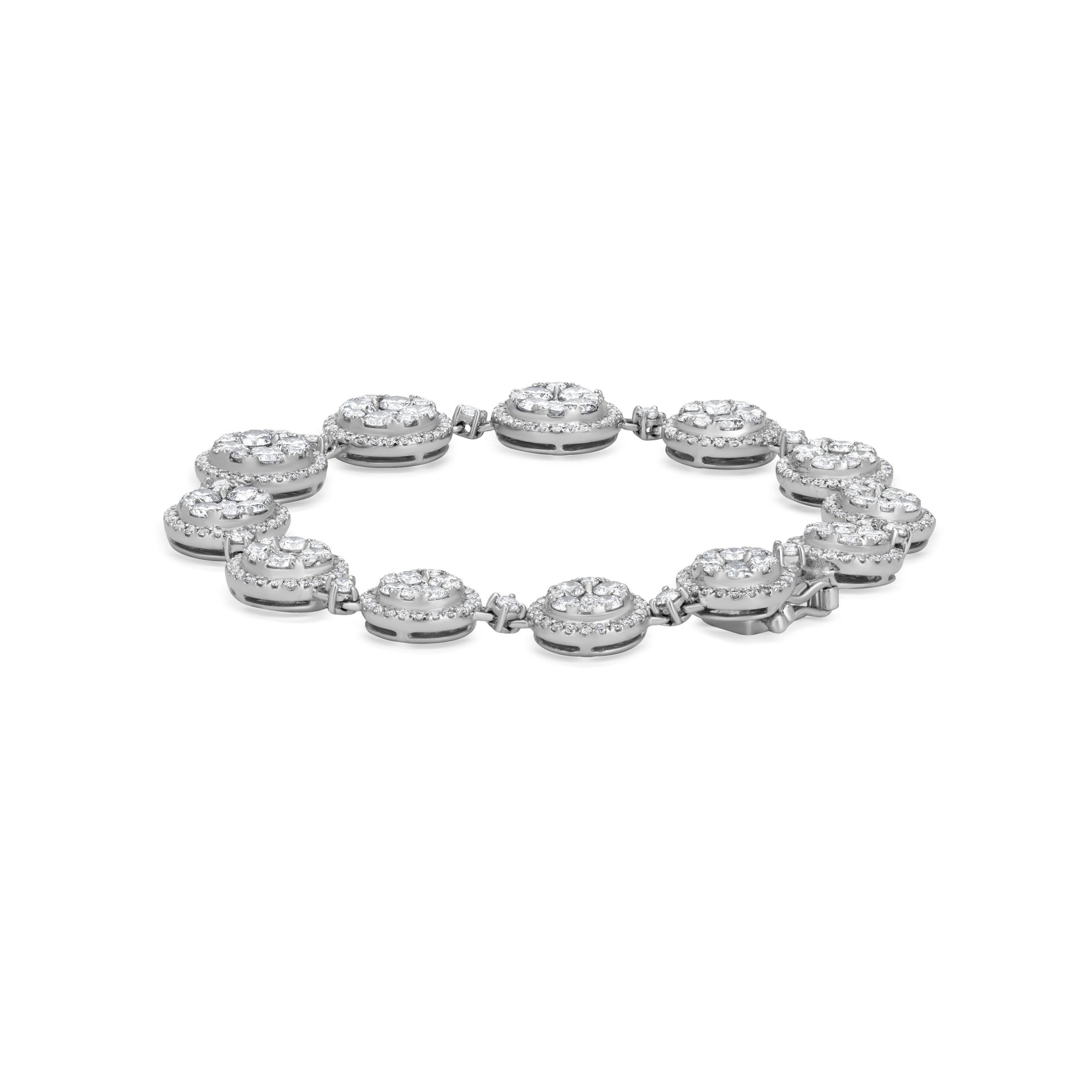 The Nigaam 6.81 Cttw. Diamond Circle Bracelet is a breathtaking piece of jewelry crafted in 18K white gold. The double latch circle design consists of symmetrical, diamond-studded circles connected to each other, making it a classic and timeless