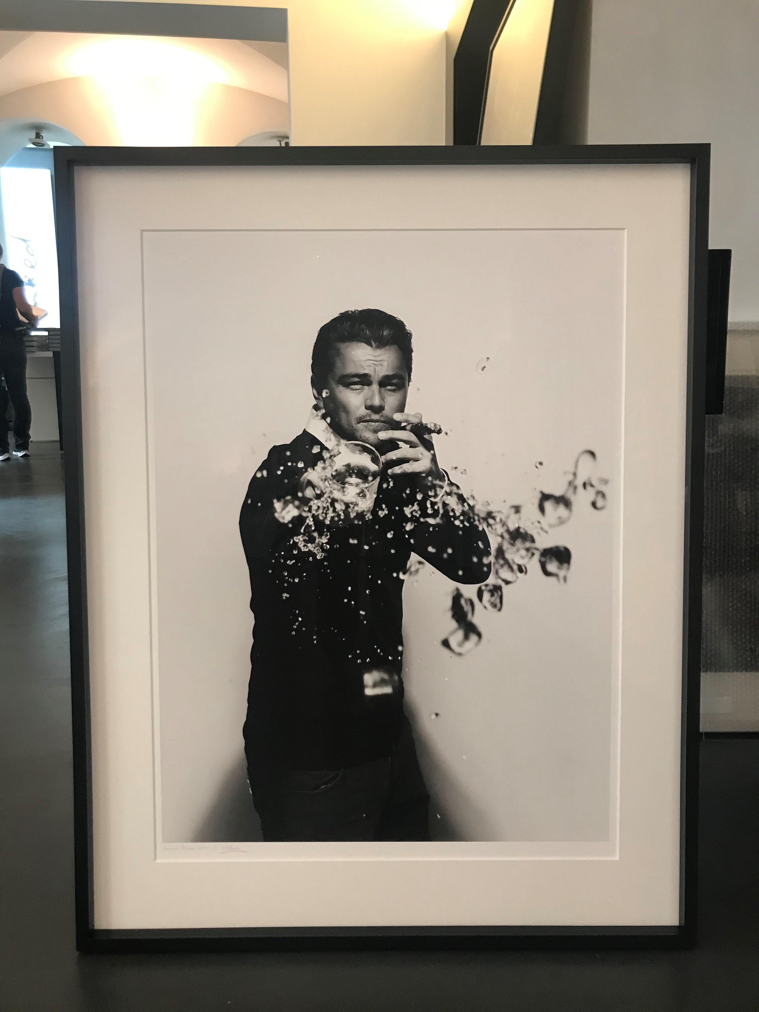 Leonardo DiCaprio spilling - portrait spilling drink, fine art photography, 2010 - Photograph by Nigel Parry