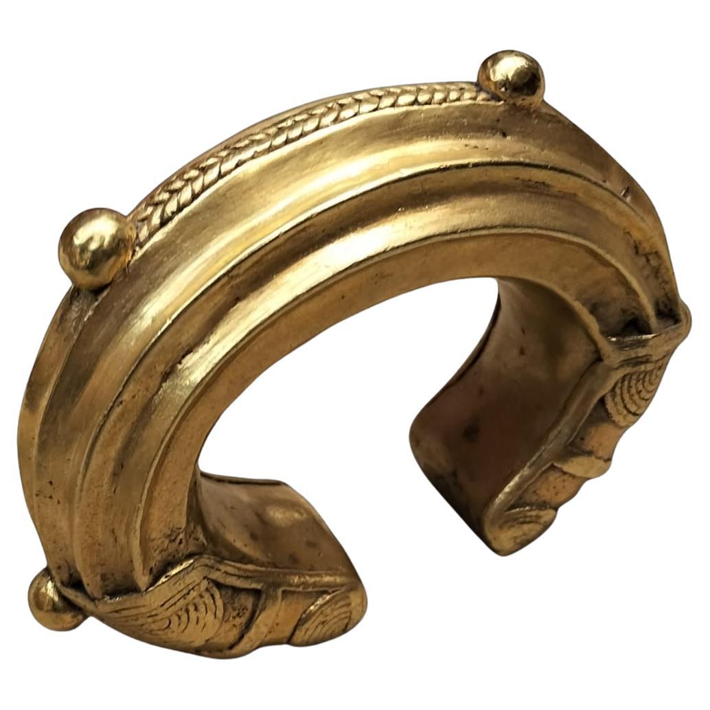 Pulsera nigeriana del siglo XIX Moneda comercial de oro y bronce