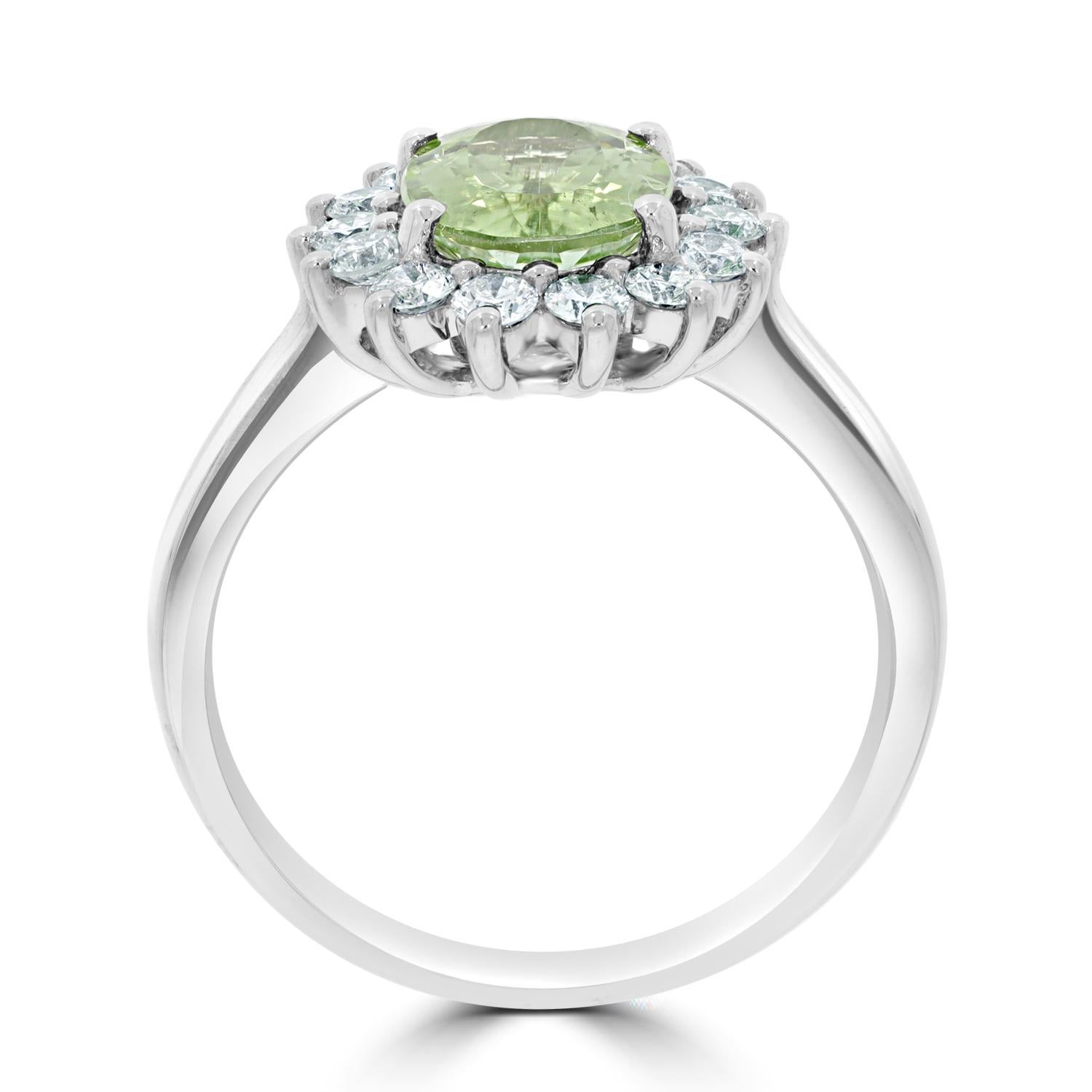 Introducing our stunning Nigerian Green Paraiba Tourmaline Ring, a true masterpiece that is sure to turn heads and capture attention. This exquisite ring features a 1.76-carat Nigerian Green Paraiba Tourmaline, expertly cut to showcase its stunning