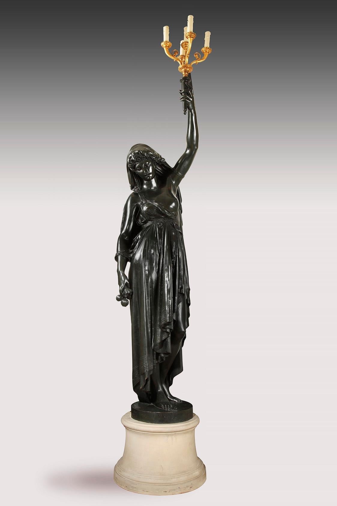 Patiné Paire de torchères en bronze par E.Colin d'après un modèle de A.Carrier, France, c. 1900 en vente