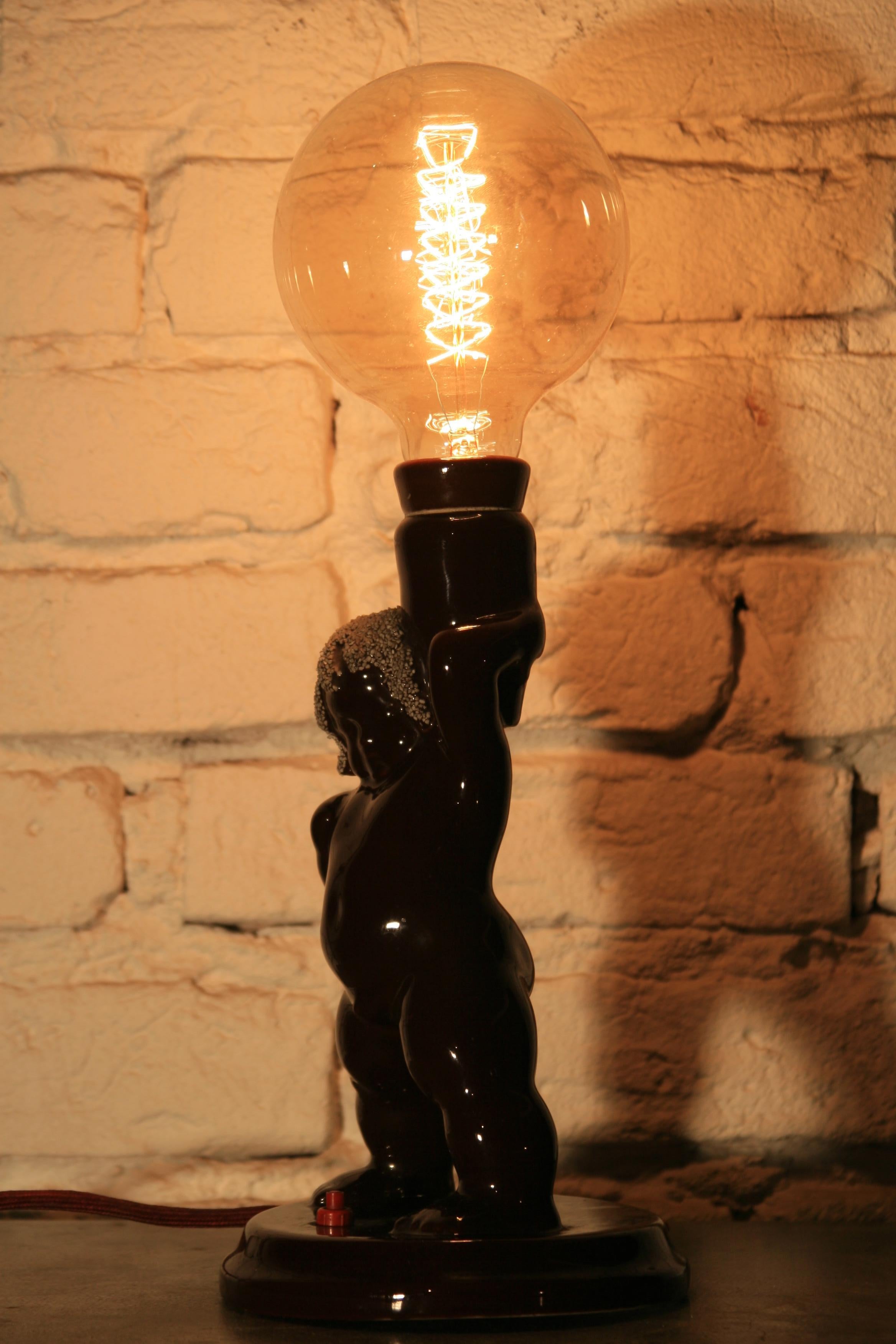 A unique night lamp from the 1950s, made in Poland. Due to a very limited series of this model, it is one of the few lamps that still exist.
Construction:
The body of the lamp is made of baked ceramic coating with varnish. The imitation of the