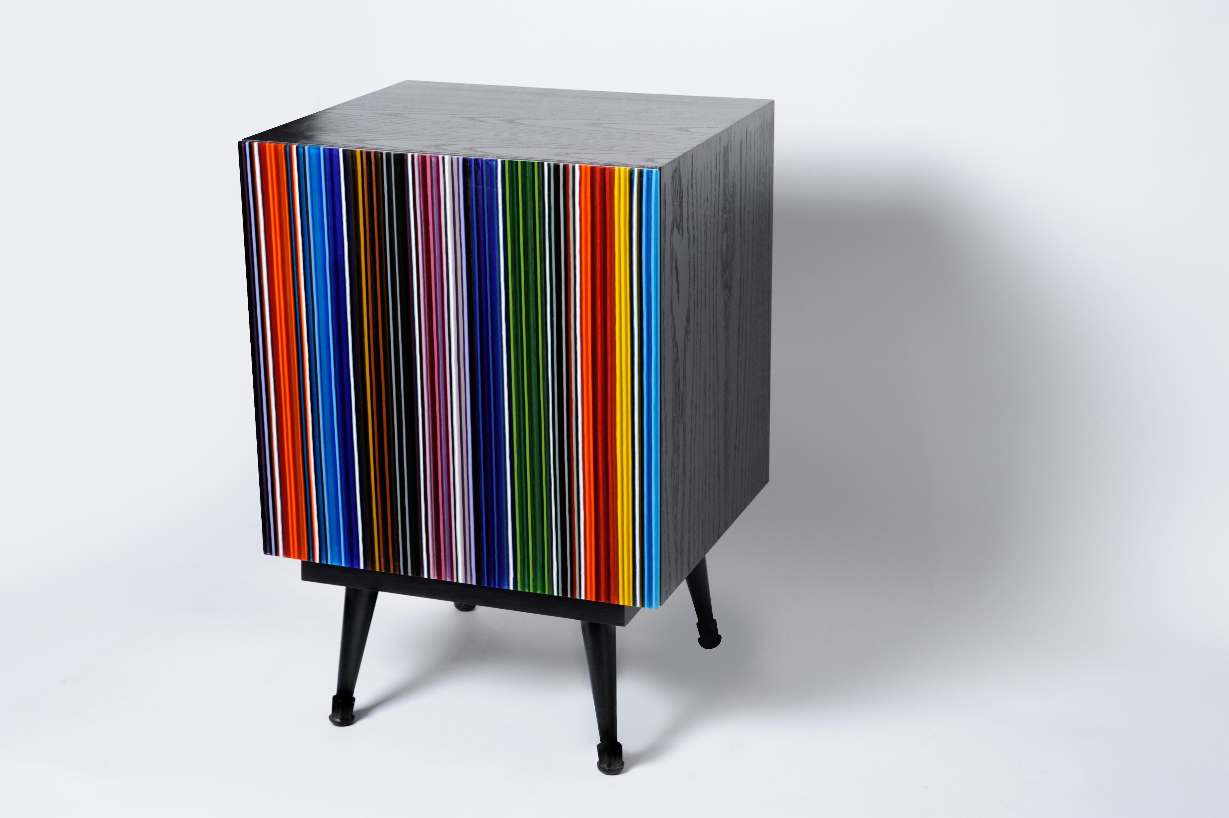 Nightstand designed by Orfeo Quagliata in collaboration with Taracea Furniture. An object of fused glass created with the exclusive barcode technique. The barcode´s retro design mixed with designer's exceptional glass expertise put together a