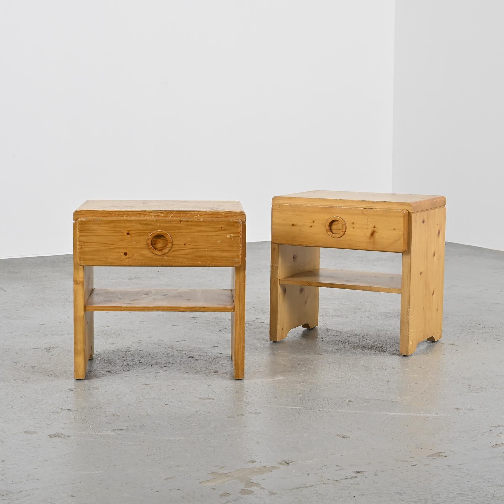 Selected By Charlotte Perriand For the Ski resort Les Arcs.

Pair of bedside tables with one drawer each, featuring circular pull handles, all made entirely of pine.

Selected for Les Arcs 1800 ski resort, circa 1975.
