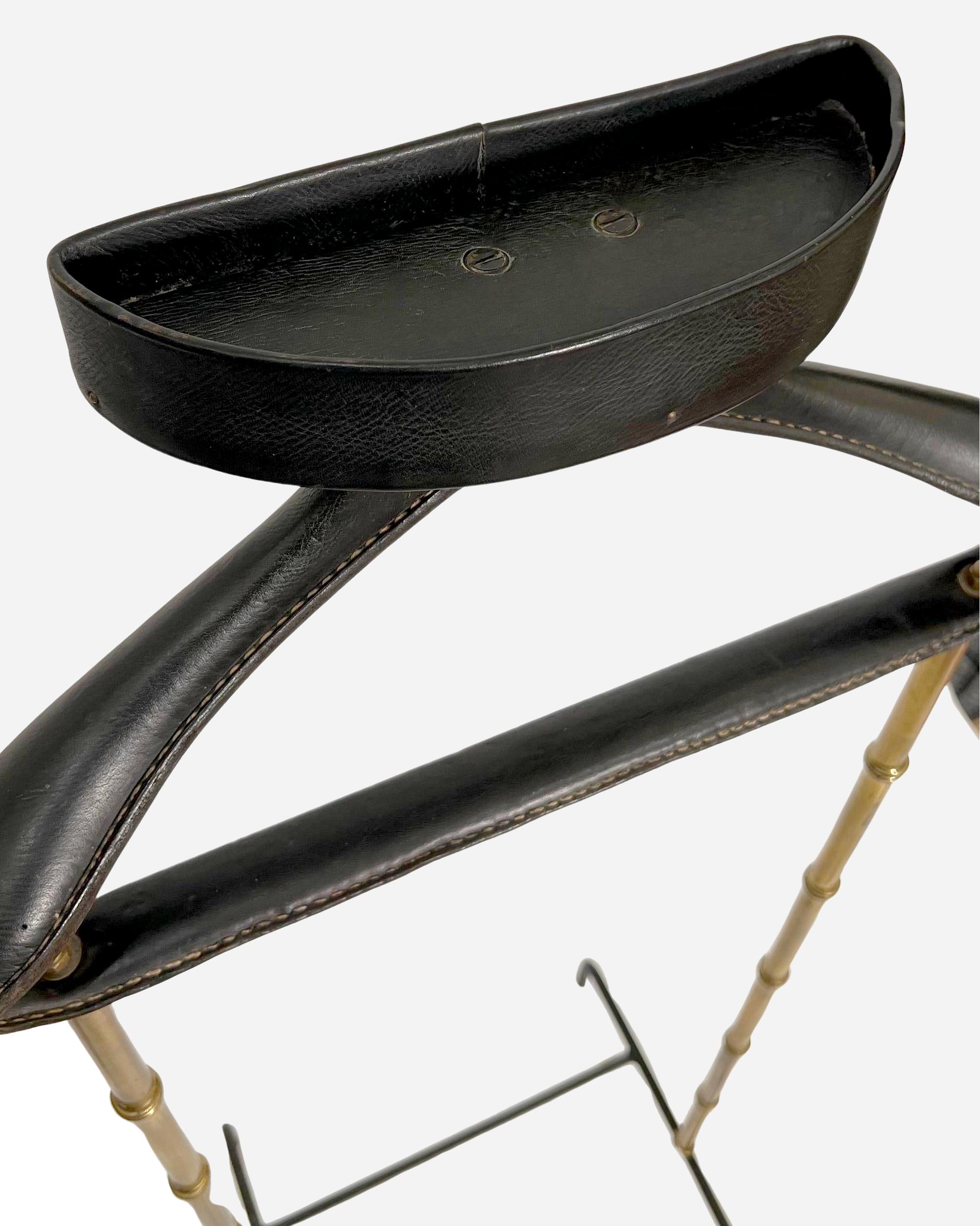 Turned Night valet in turned brass and black leather by J. Adnet, France circa 1950 For Sale