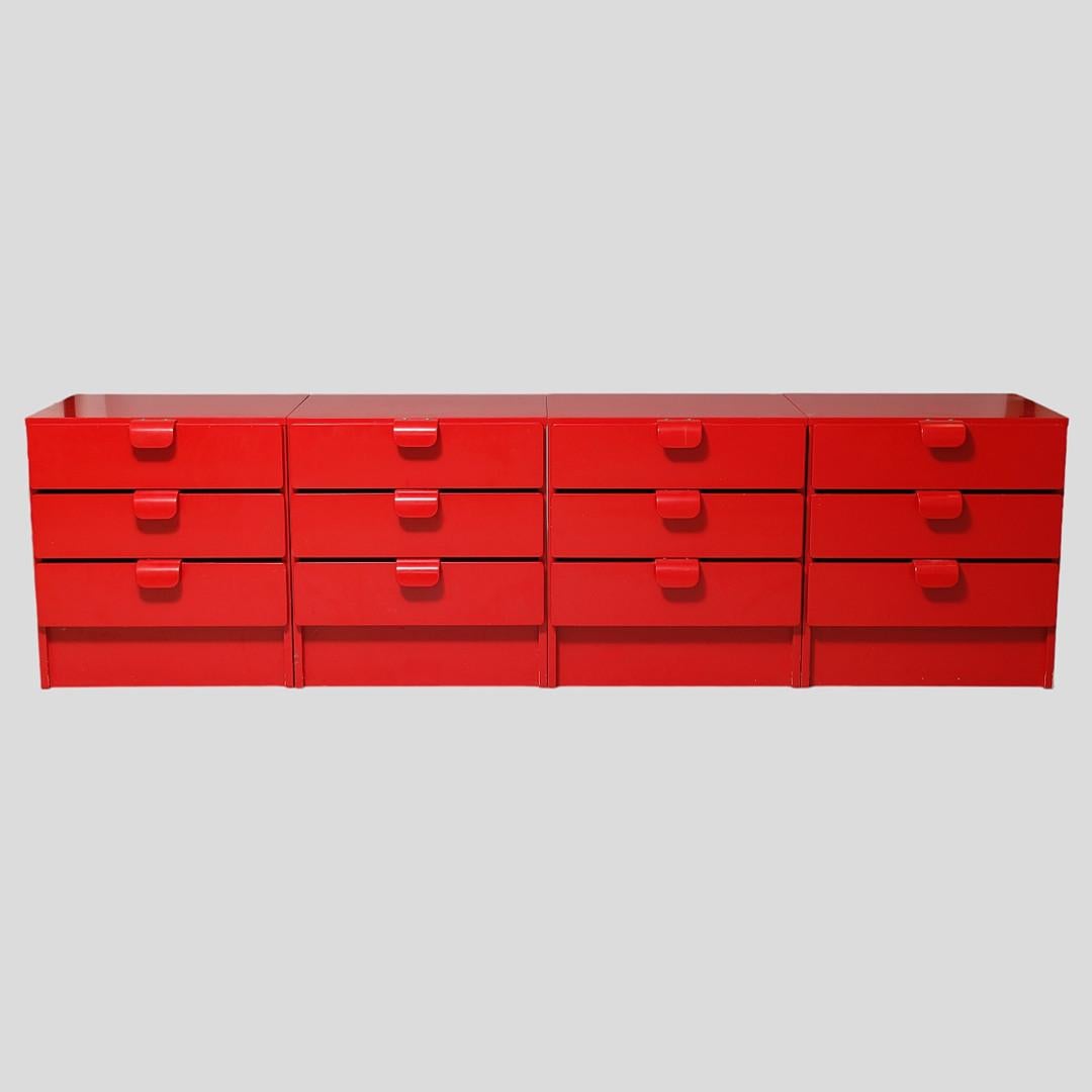 4 red lacquered dressers that can be put together into a sideboard.
Manufactured at Asko, Finland around 1960
Dimensions (per chest of drawers):
Height: 65 cm.
Width: 60.2 cm.
Depth: 55.6 cm.
Good condition, some light scratches 
4 nightstands/