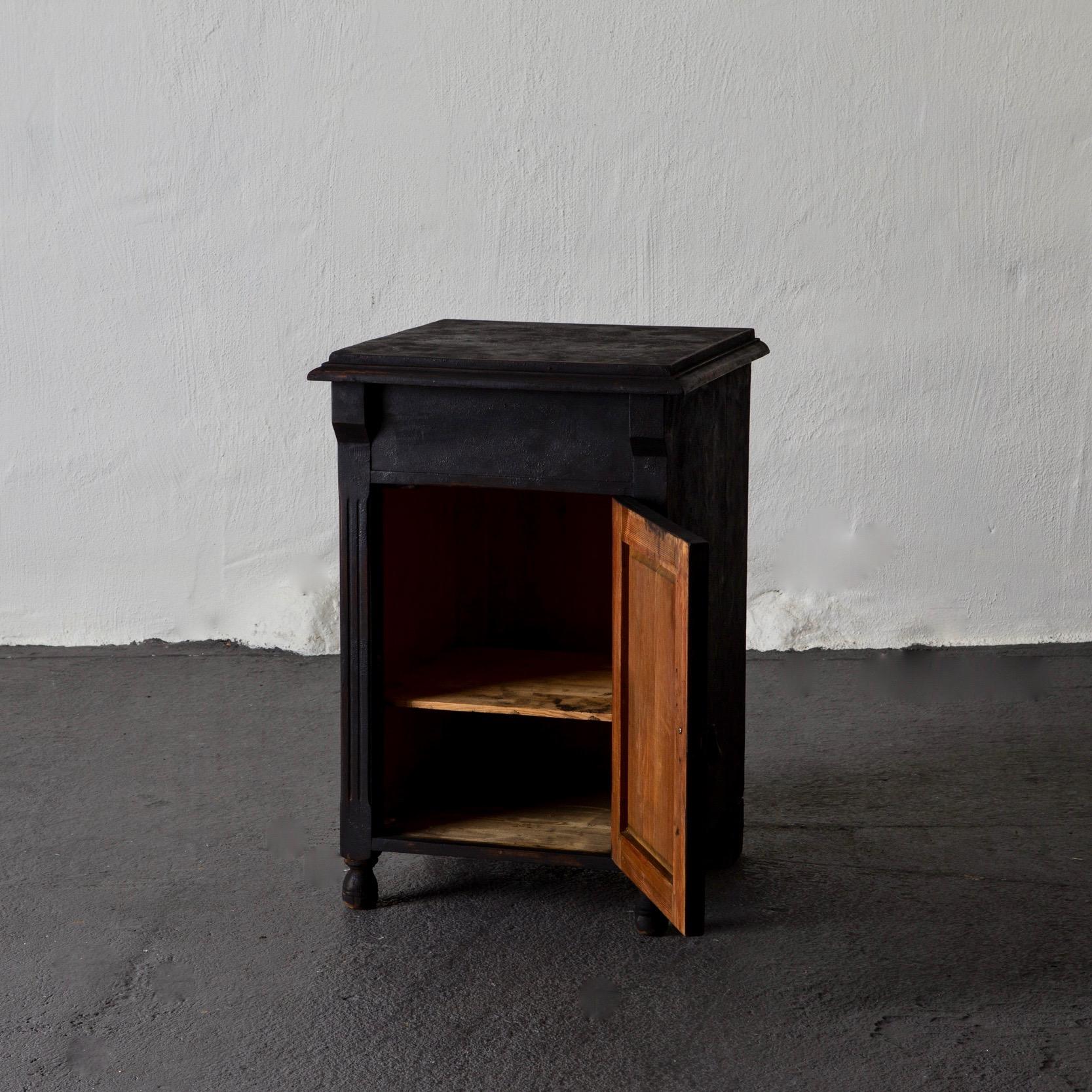 Nightstand Swedish black, 19th century, Sweden. A nightstand made during the late part of 19th century in Sweden. Painted in our Laserow Black with contemporary hardware. 

 