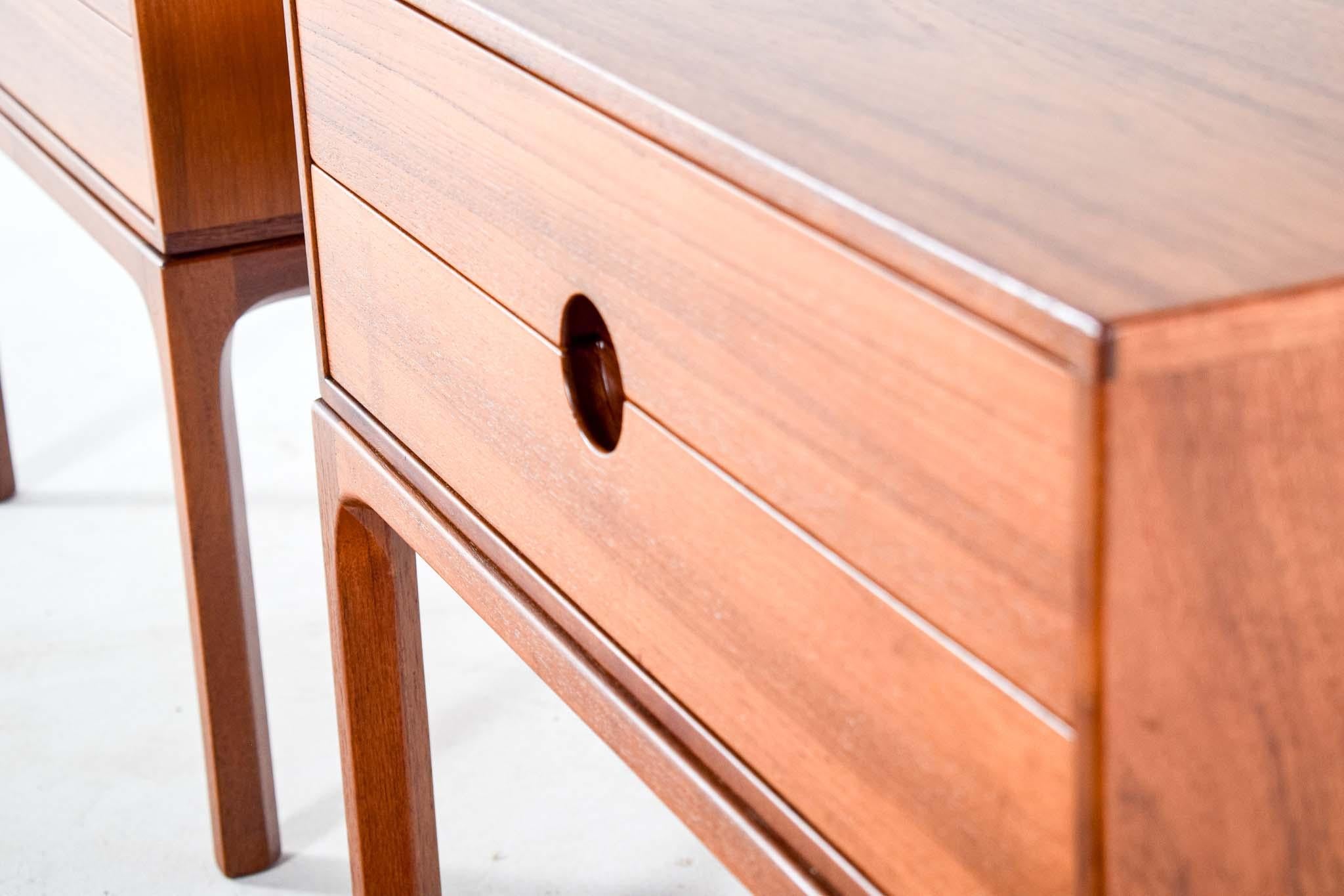This exquisite pair of bedside tables, model 384, designed by the renowned Kai Kristiansen for Aksel Kjersgaard in Odder, Denmark, epitomizes the elegance and functionality of mid-century modern design. Crafted in 1960, these tables are made from