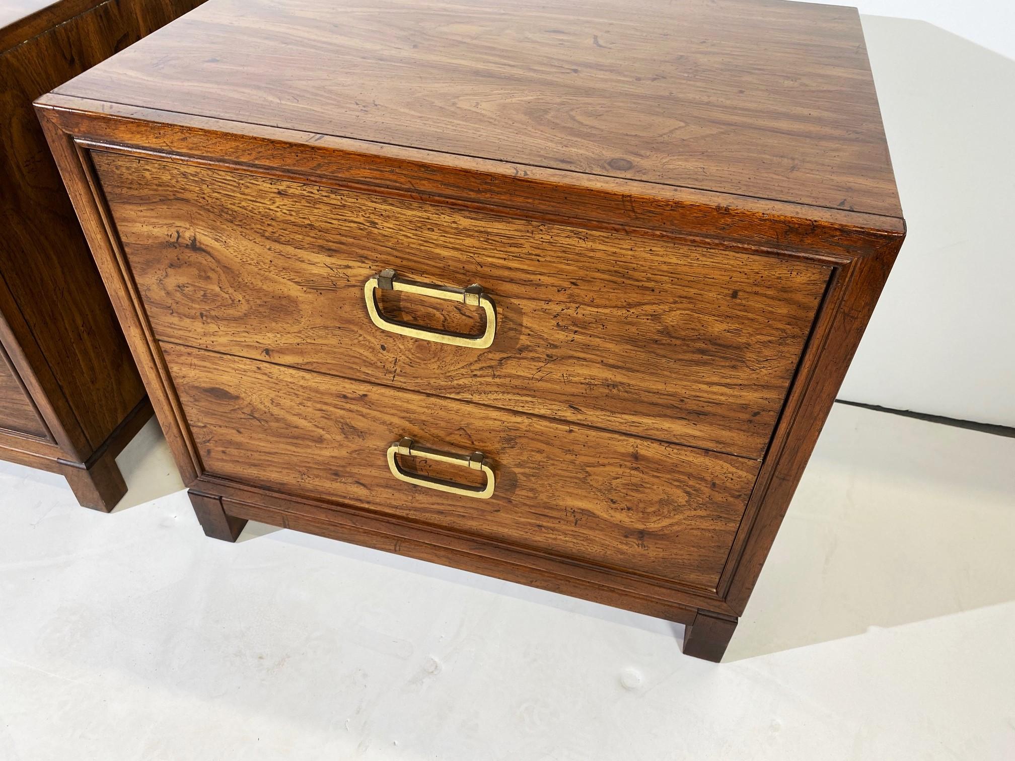 Pair of nightstands by Drexel. Two drawers with brass pulls.