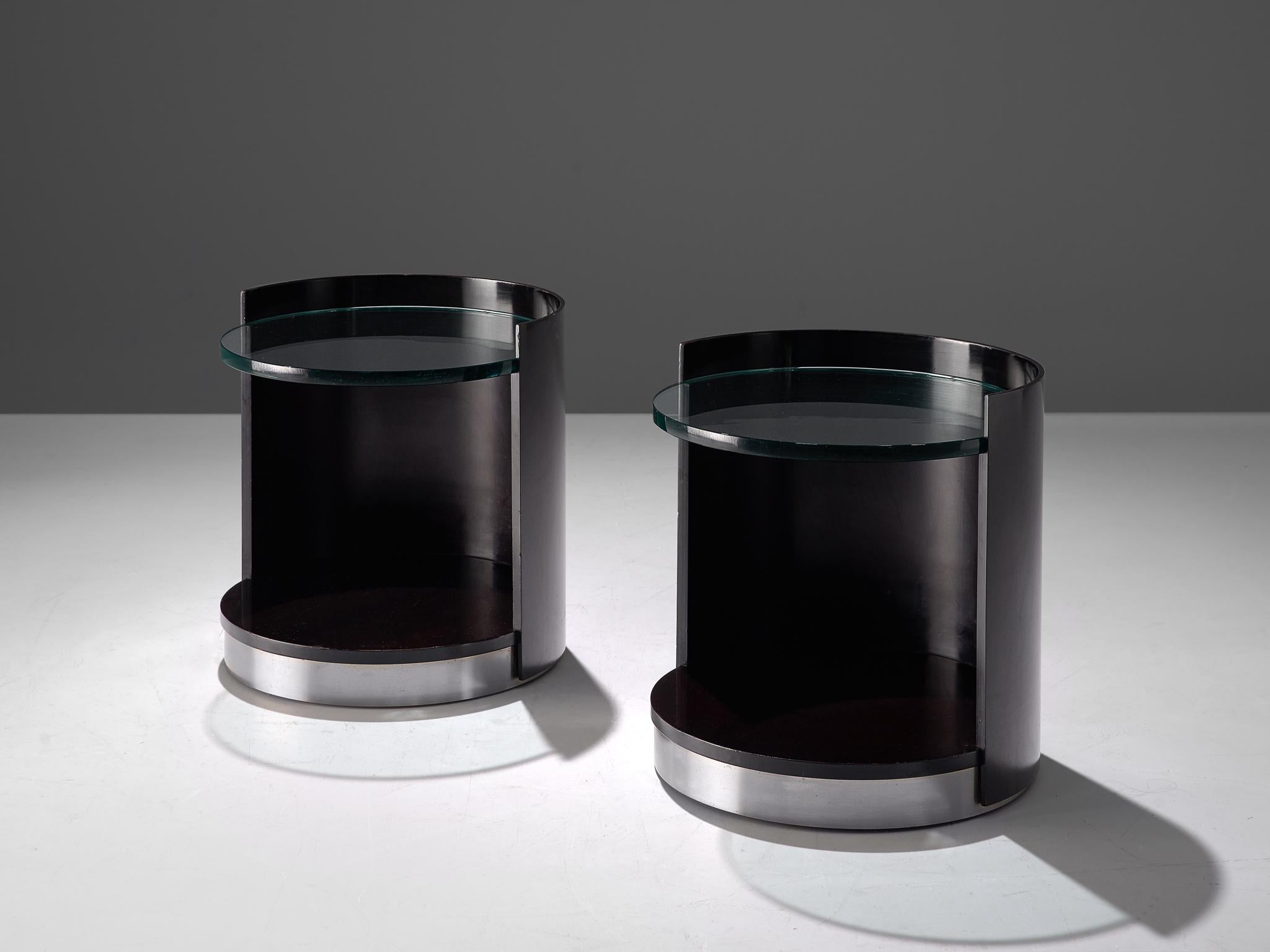 Gianni Moscatelli for Formanova, pair of side tables, wood, glass and metal, Italy, 1970s

Postmodern pair of nightstands by Gianni Moscatelli for Formanova. The tables have a cylindrical shape, featuring a black lacquered wood frame that's open