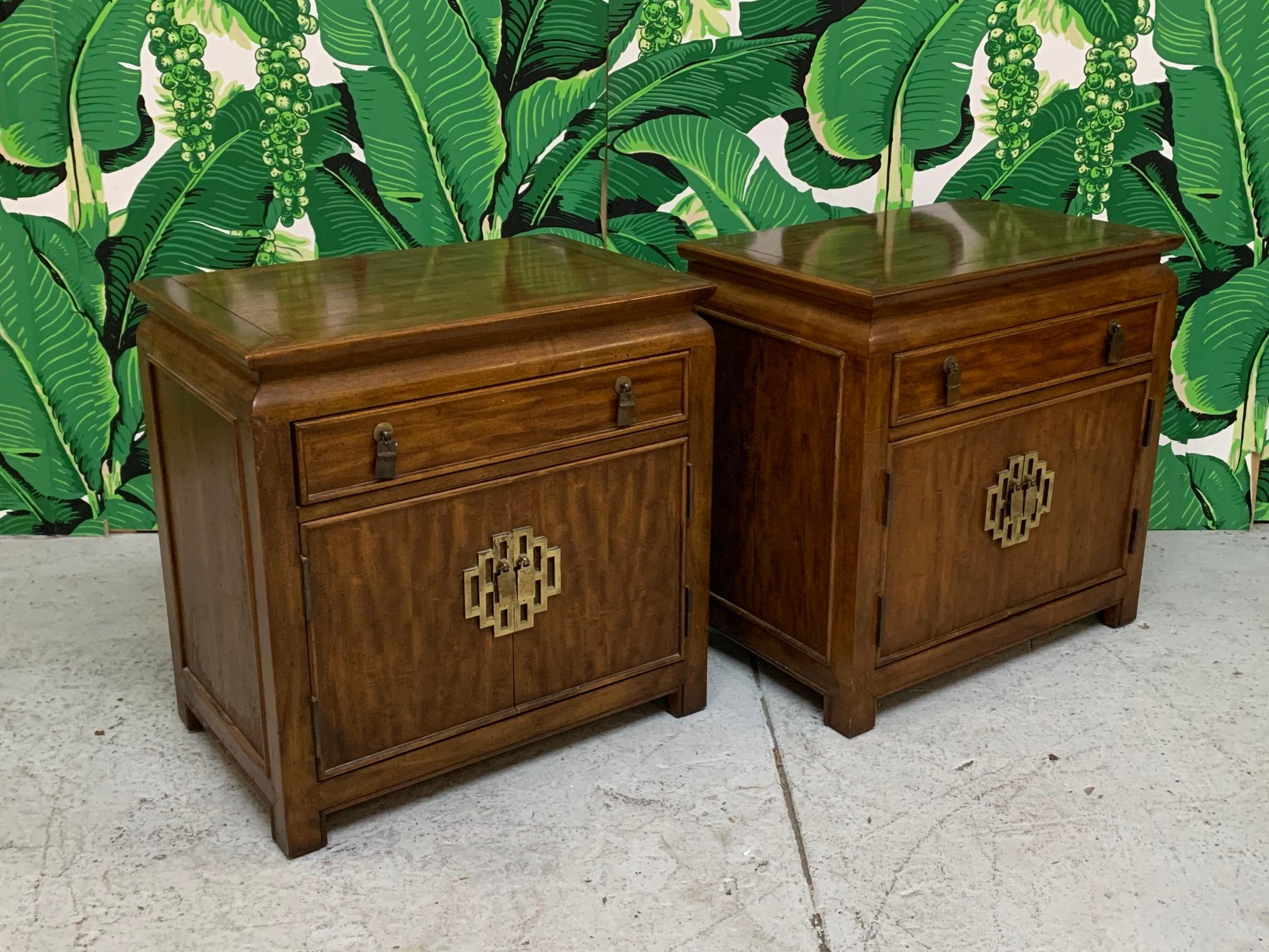 Pair of Asian chinoiserie nightstands by Raymond Sobota for the Century Furniture Chin Hua collection. Asian styling and heavy brass hardware. Very good condition with minor imperfections consistent with age, including marks on surface from pads