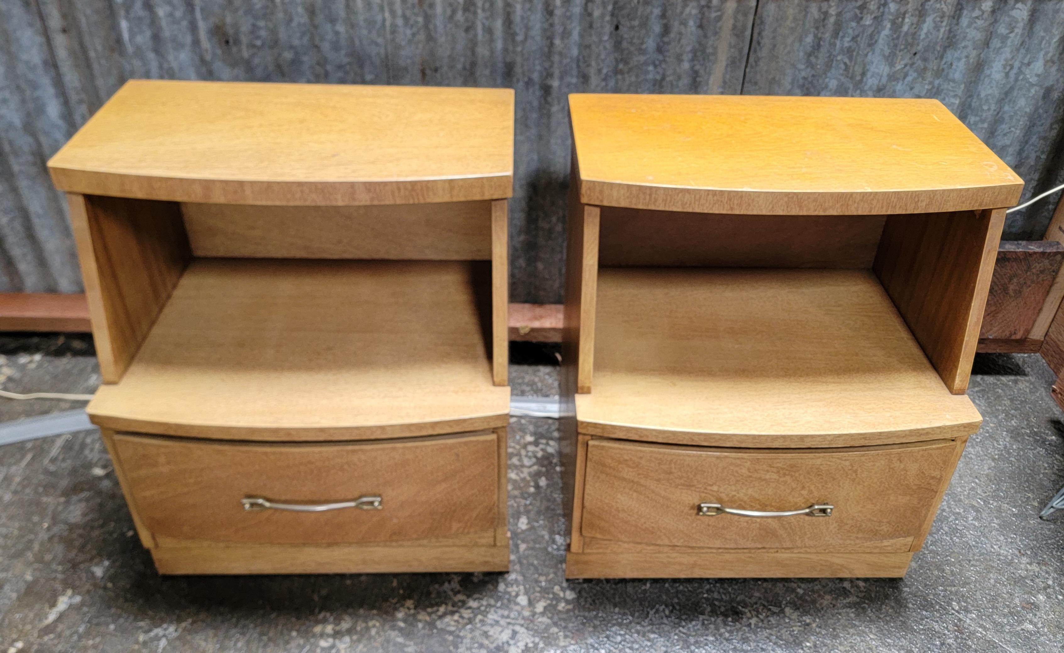 A pair of Mid-Century Modern nightstands with large storage drawer and shelf. Original finish and hardware. Solid oak secondary wood with dovetail construction. Quality made set with age-appropriate wear from use.

26 inches high.
22.25 inches