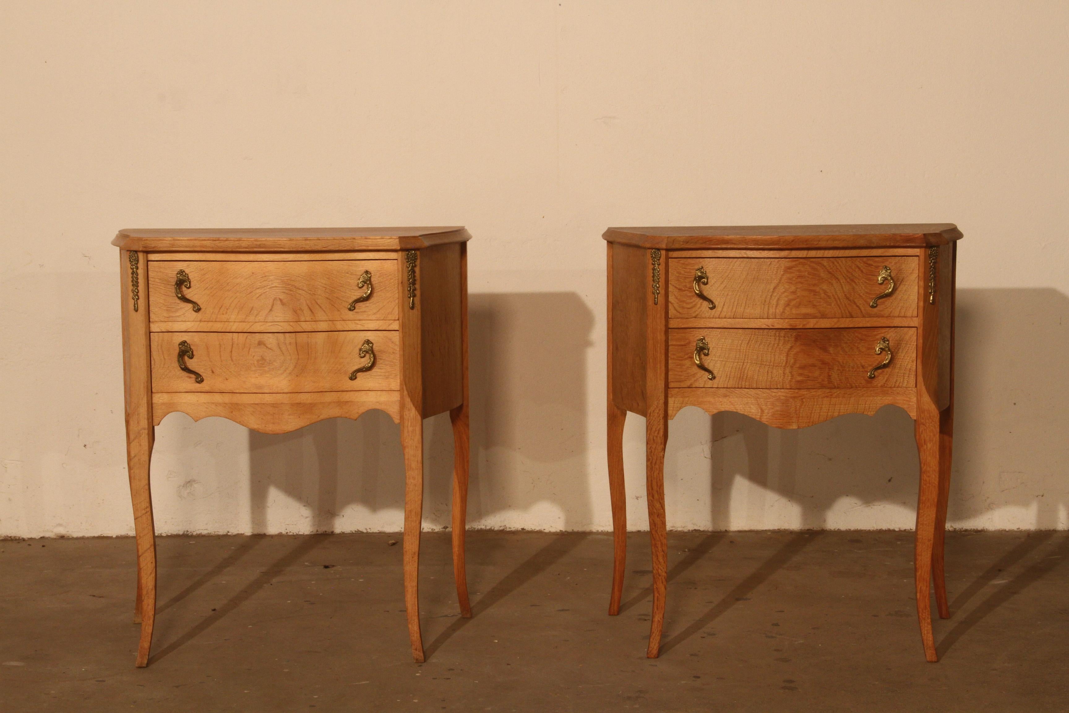 A charming pair of vintage 1960s light oak bedside tables from Denmark. This matching pair beautifully complements each other, with slight natural differences in patina—one table slightly lighter than the other—which enhances their unique character.