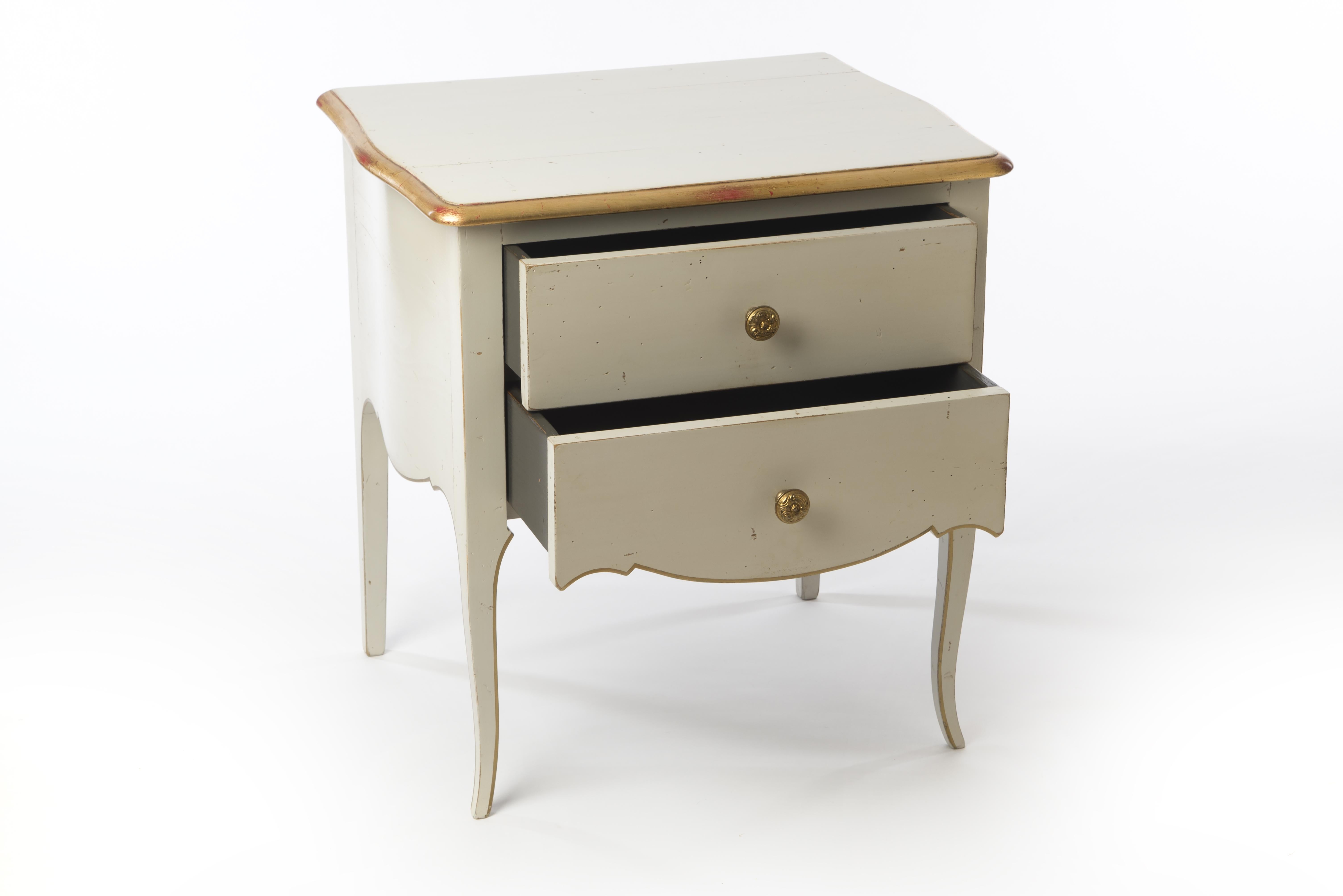 This pair of beautifully designed nightstands in the style of Louis XV are not only pretty but also practical. The size of the nightstands and two drawers make them a useful companion in the bedroom. The bowed sides and bronze handles add charm and