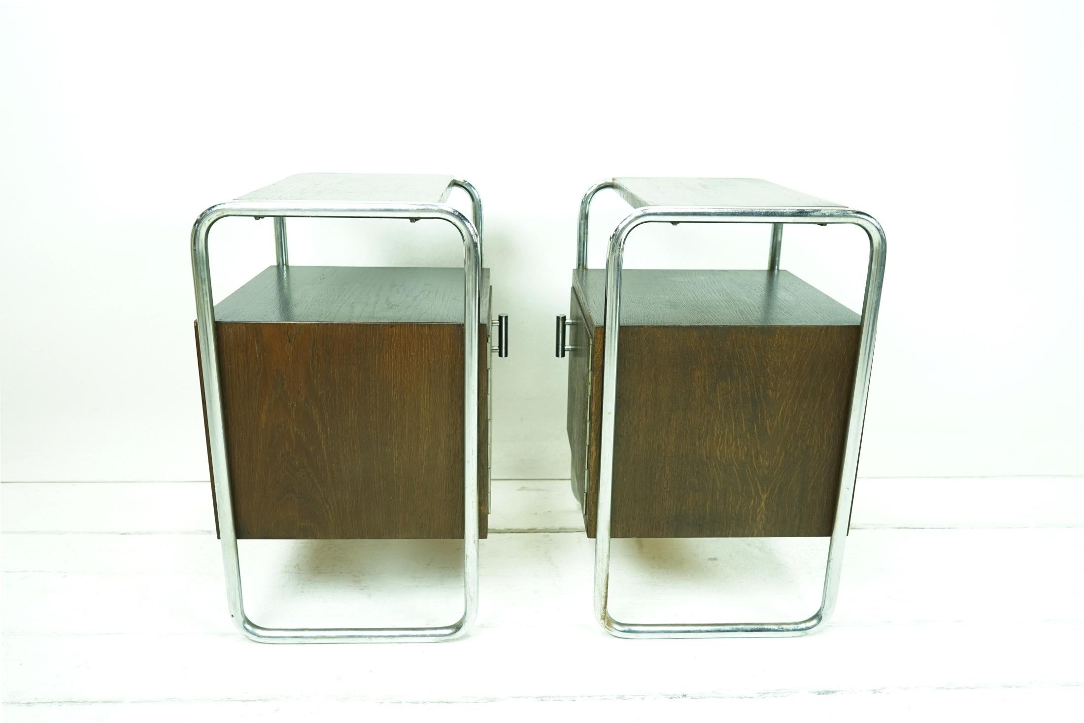 Object: side table - wood/chrome (set 2 pieces)

Time: Original around 1935

Style: Bauhaus

Manufacturer/Designer: Slezak/Thonet

Dimensions: W 40 H 60 D 37 +knob

Bauhaus nightstands from the 30s.
The steel tube has been polished and