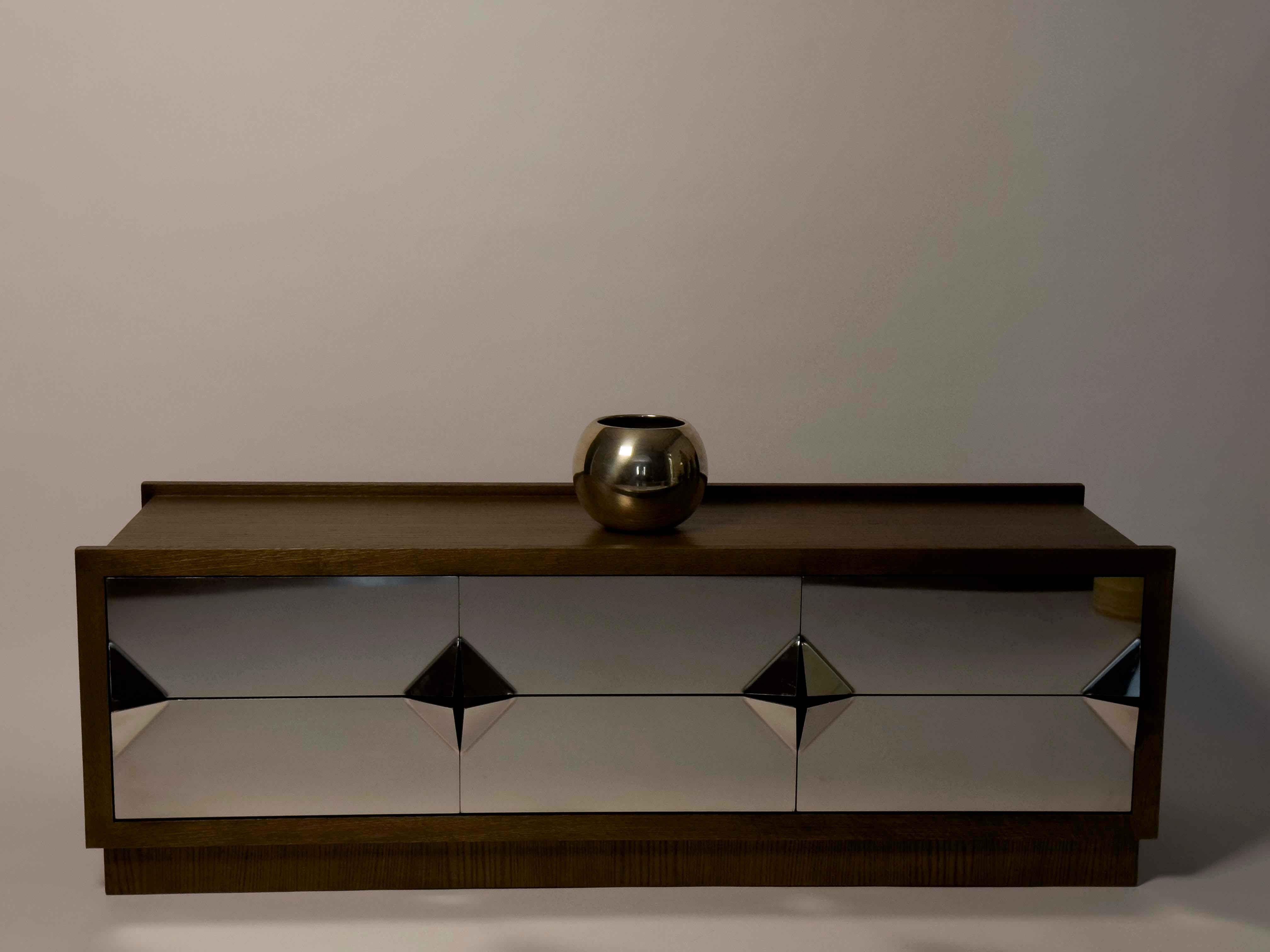 The NIGMA TV console, shown here in walnut stained, oak with drawer fronts in mirror-polished, stainless steel. The console is designed by Hassan Abouseda for HAF.Custom made to order through 1stDibs. Also available in our showroom in Cairo, Egypt.