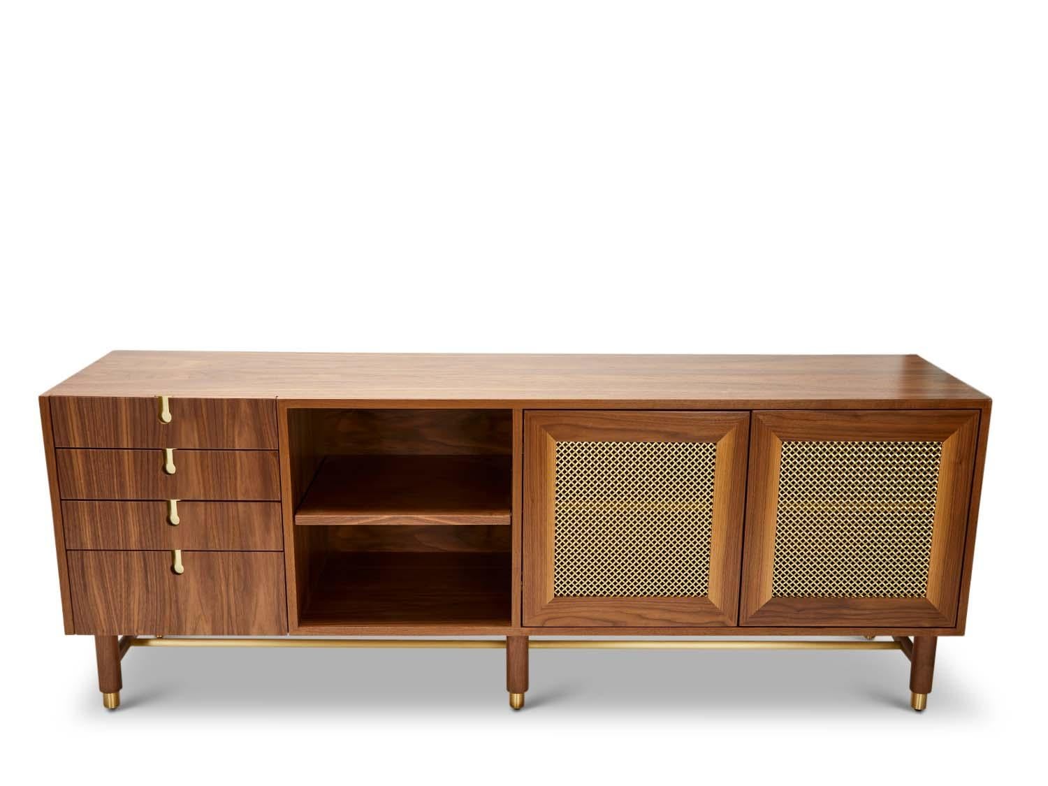 The Niguel Credenza features brass cap feet, a brass cross-stretcher bar and brass inlaid details with brass mesh sliding bypass doors. 

The Lawson-Fenning Collection is designed and handmade in Los Angeles, California. Reach out to discover what
