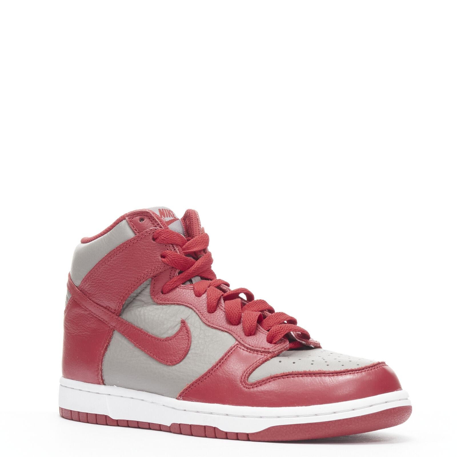 NIKE Dunk High UNLV soft grey university red high top dunk sneaker US8 EU38
Reference: TGAS/B01143
Brand: Nike
Model: Dunk High UNLV
Material: Leather
Color: Grey, Red
Pattern: Solid
Closure: Lace Up
Made in: Vietnam

CONDITION:
Condition: