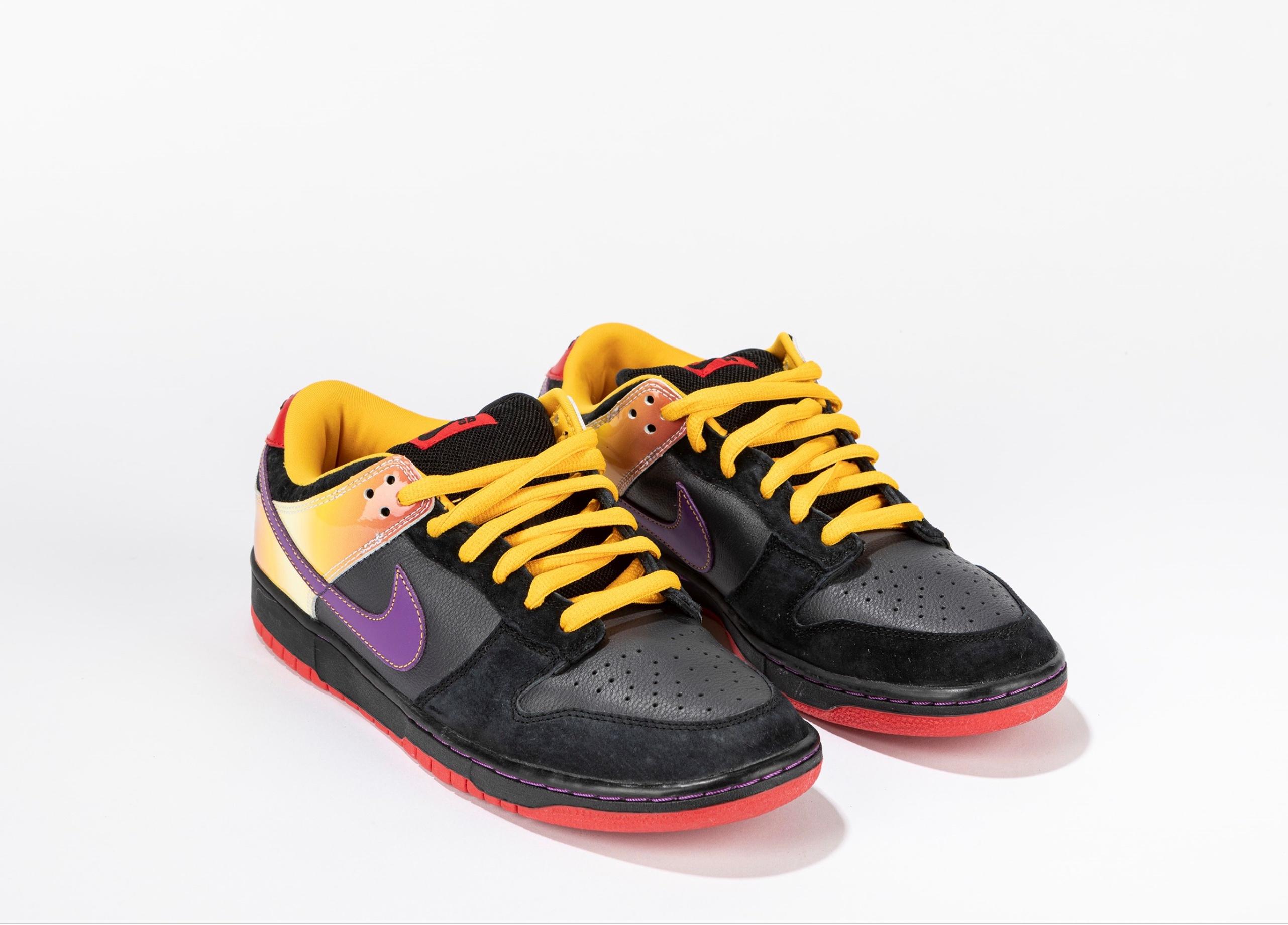 The Nike Dunk SB Low Appetite for Destruction are a limited edition of the classic Nike Dunk SB sneakers. Made in 2018 in collaboration with Guns N' Roses, these shoes feature a black leather upper with colorful themed details inspired by the