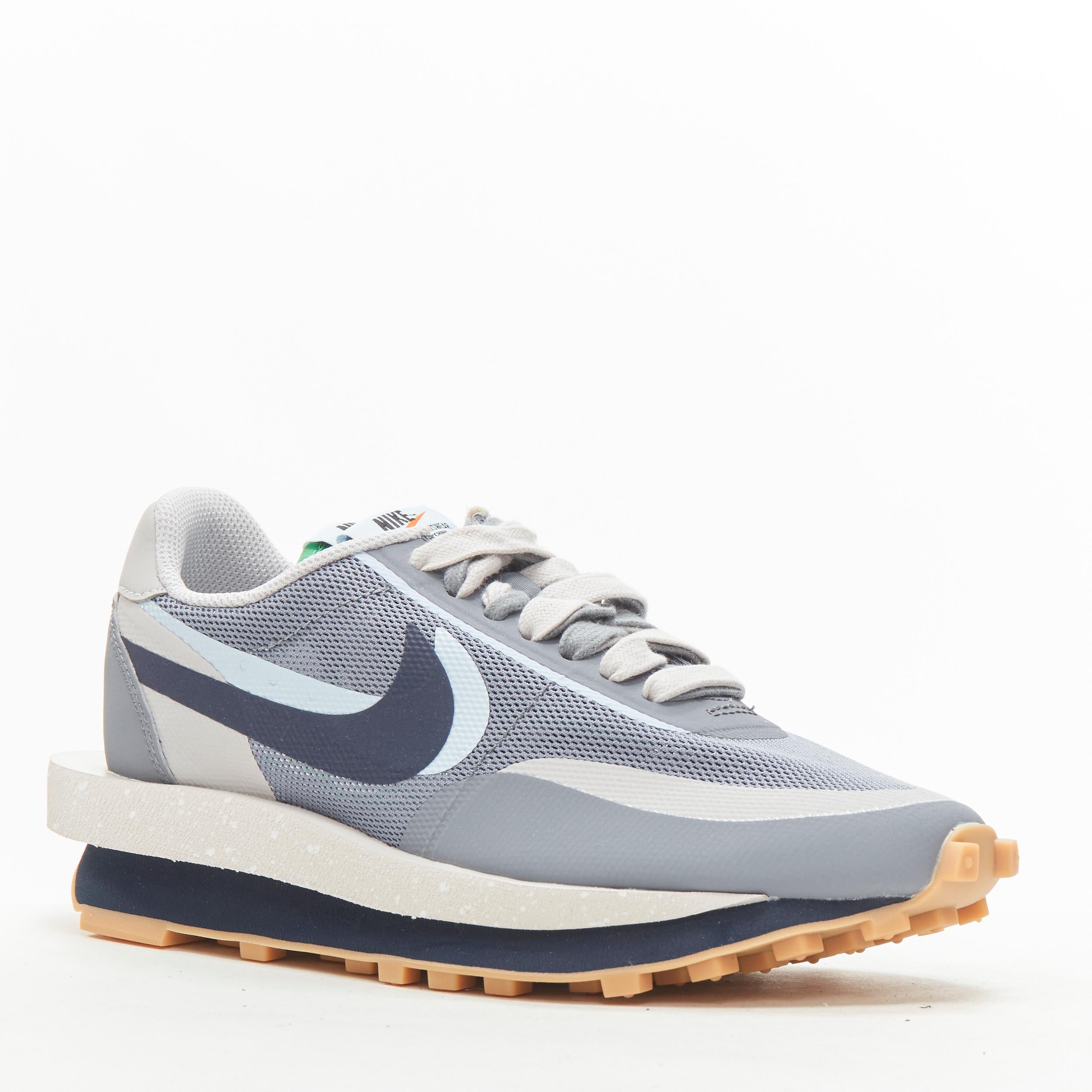 NIKE SACAI CLOT LD Waffle DH3114 001 grey navy sneaker US5 EU37.5 
Reference: ANWU/A00349 
Brand: Nike 
Designer: Sacai 
Model: DH3114 001 
Collection: Clot Collaboration 
Material: Fabric 
Color: Grey 
Pattern: Solid 
Closure: Lace 
Extra Detail:
