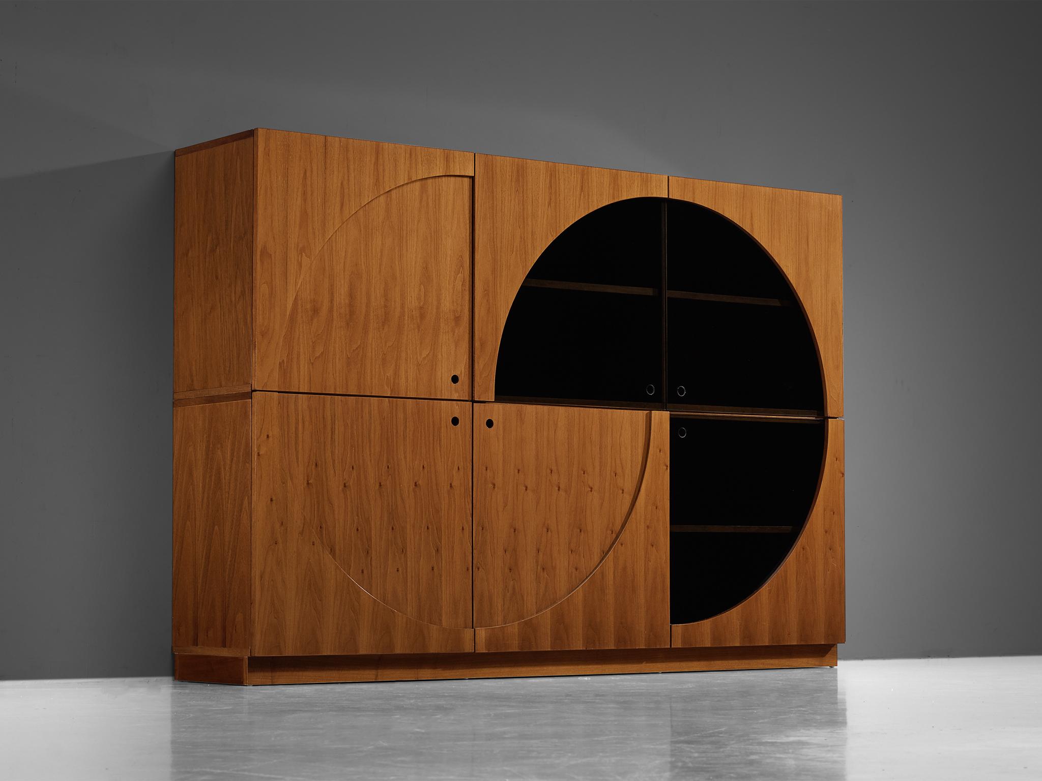 Nikol International storage unit/sideboard, walnut, smoked glass, Italy, 1970s/begin 1980s

Presenting an exquisite sideboard that skillfully balances form and function with its graceful use of round lines, this piece is a visual delight. Crafted