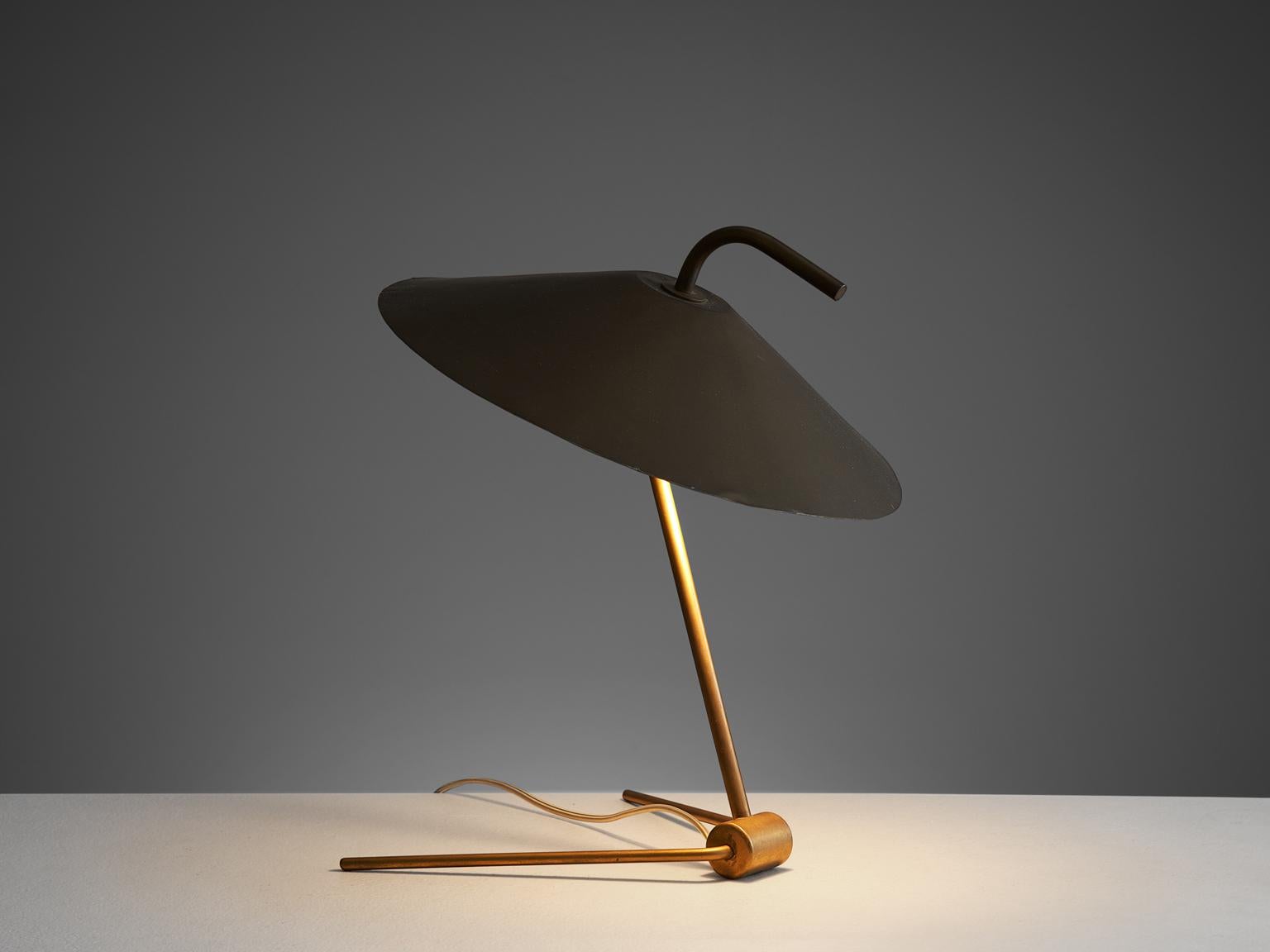 Nikolay Diulgheroff, desk light, brass and metal, Italy, 1940s.

This futuristic table lamp is designed by the Bulgarian artist, architect and designer Nikolay Diulgheroff. The piece has a brass tripod foot and a large round shade. On the top of