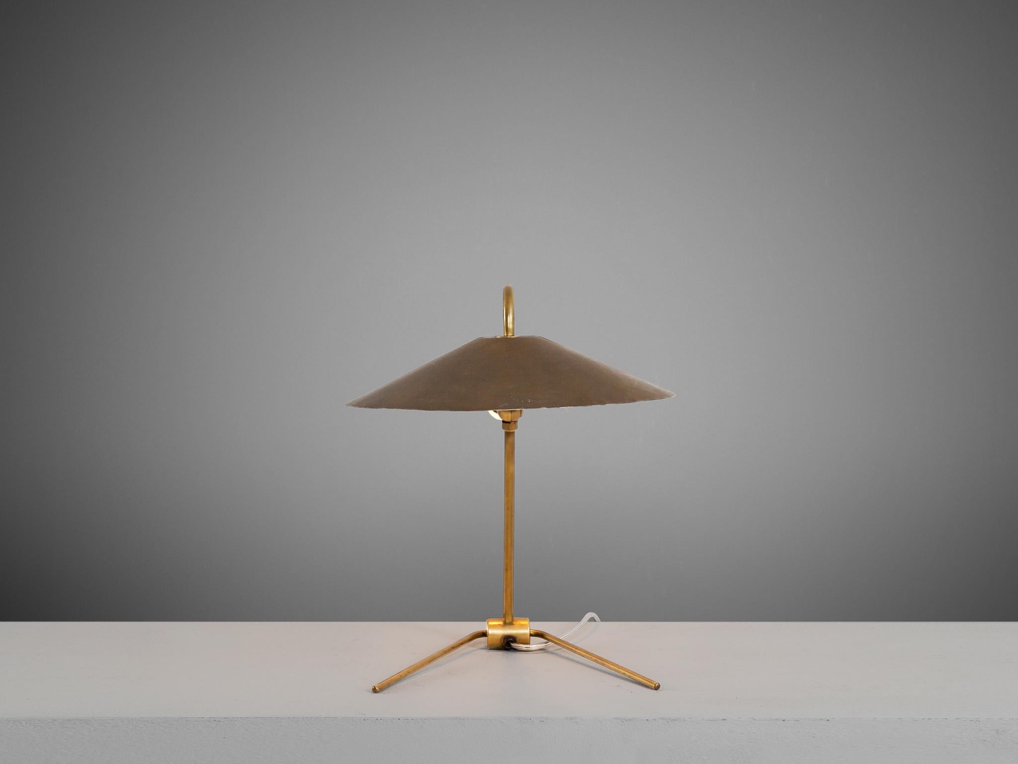 Nikolay Diulgheroff, table light, brass, Italy, 1930s. 

Very elegant table lamp in brass. This simplistic design is excellent. A thin brass stern is the frame of the large brass shade which is adjustable to every position admired. The golden tones