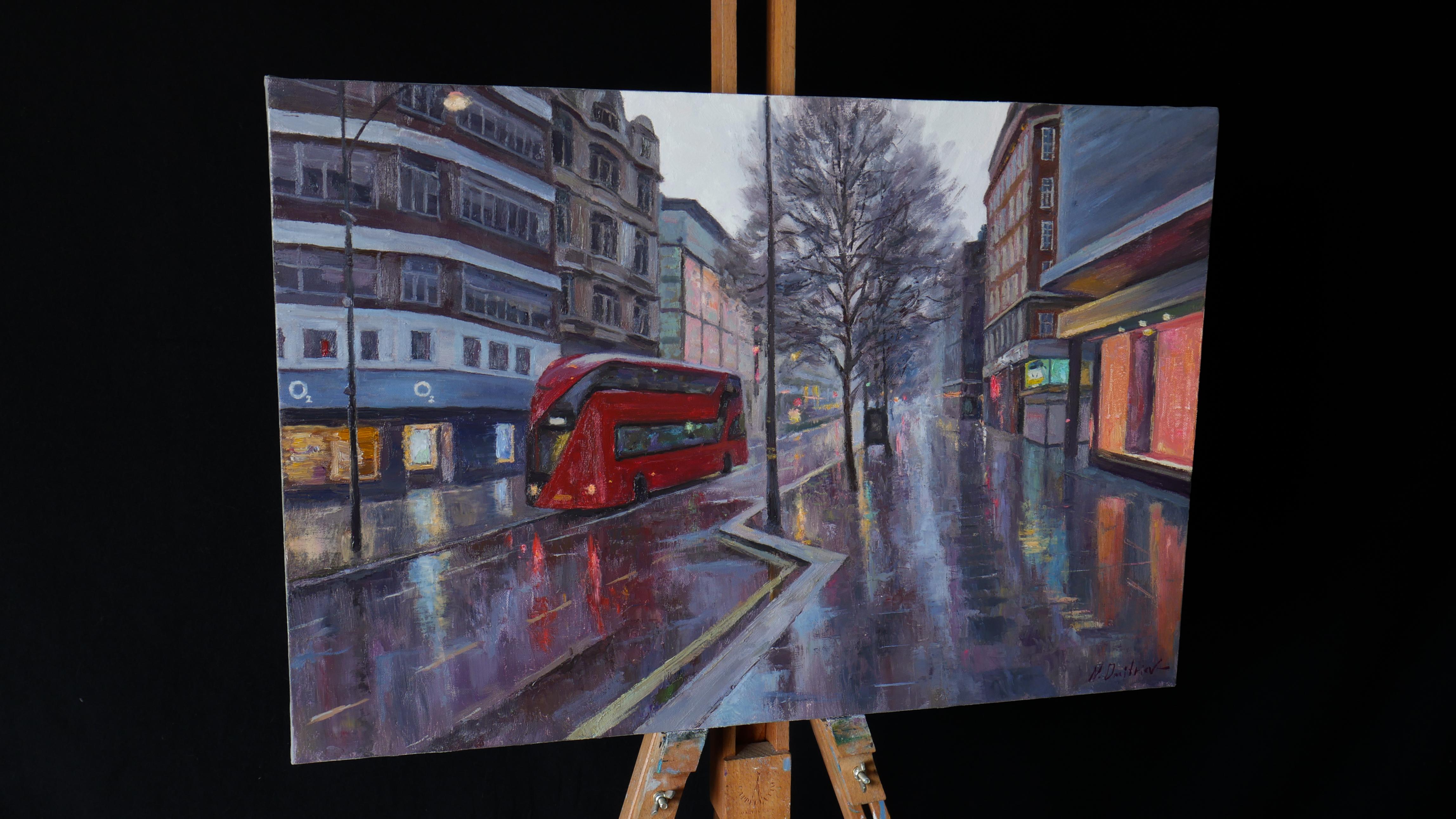 Cityscape with London is a stylish painting for your home or office. Oxford Street is one of the main streets of Westminster. The street is mainly known for its fashionable shops.
The rainy weather, a double-decker red bus and multicolored lights of