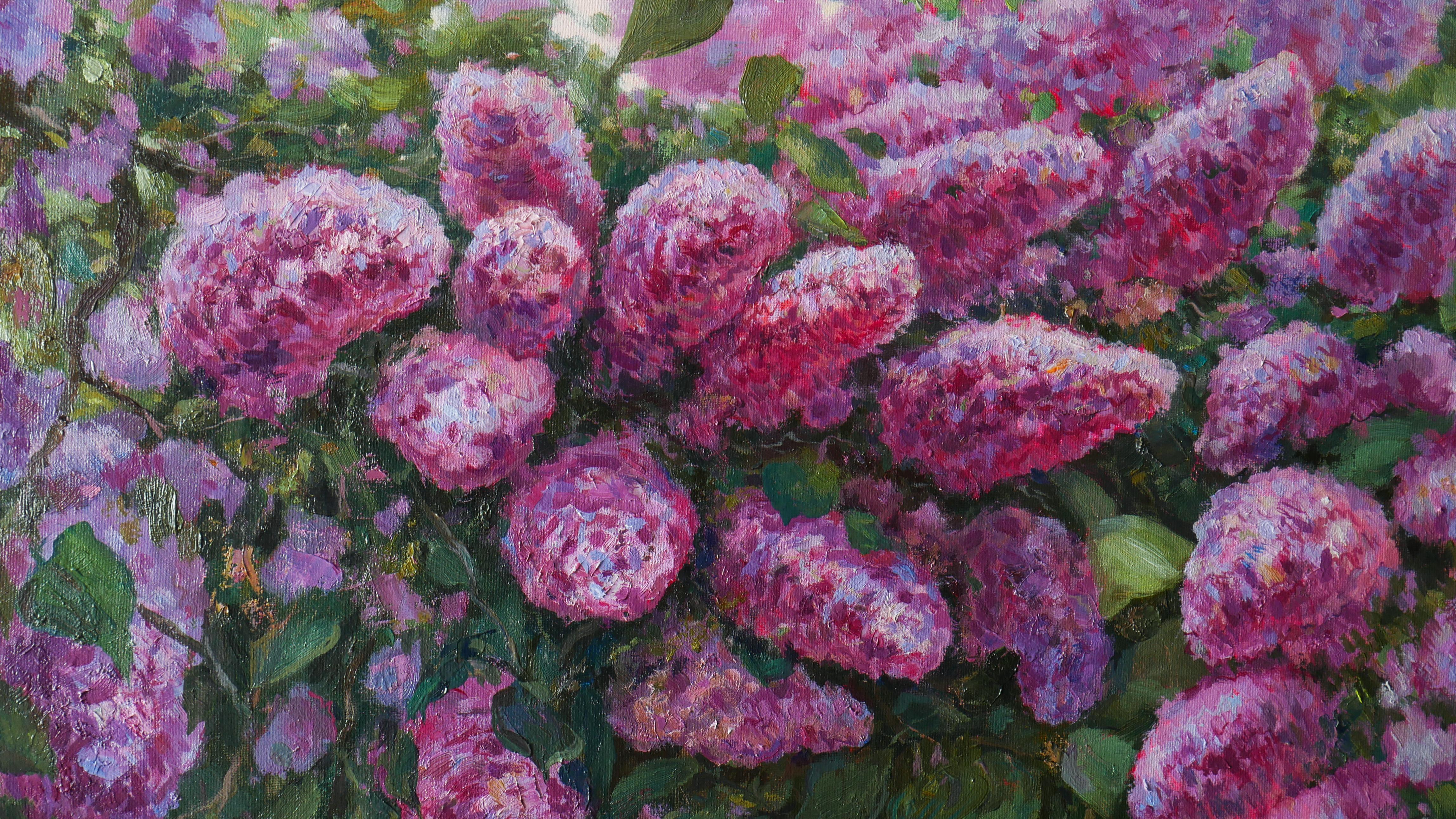 The painting captures a lush lilac bush in full bloom. Sunlight filters through the petals, creating a soft glow. The rich greens of the foliage contrast beautifully with the vibrant clusters of blossoms, evoking a sense of freshness and springtime