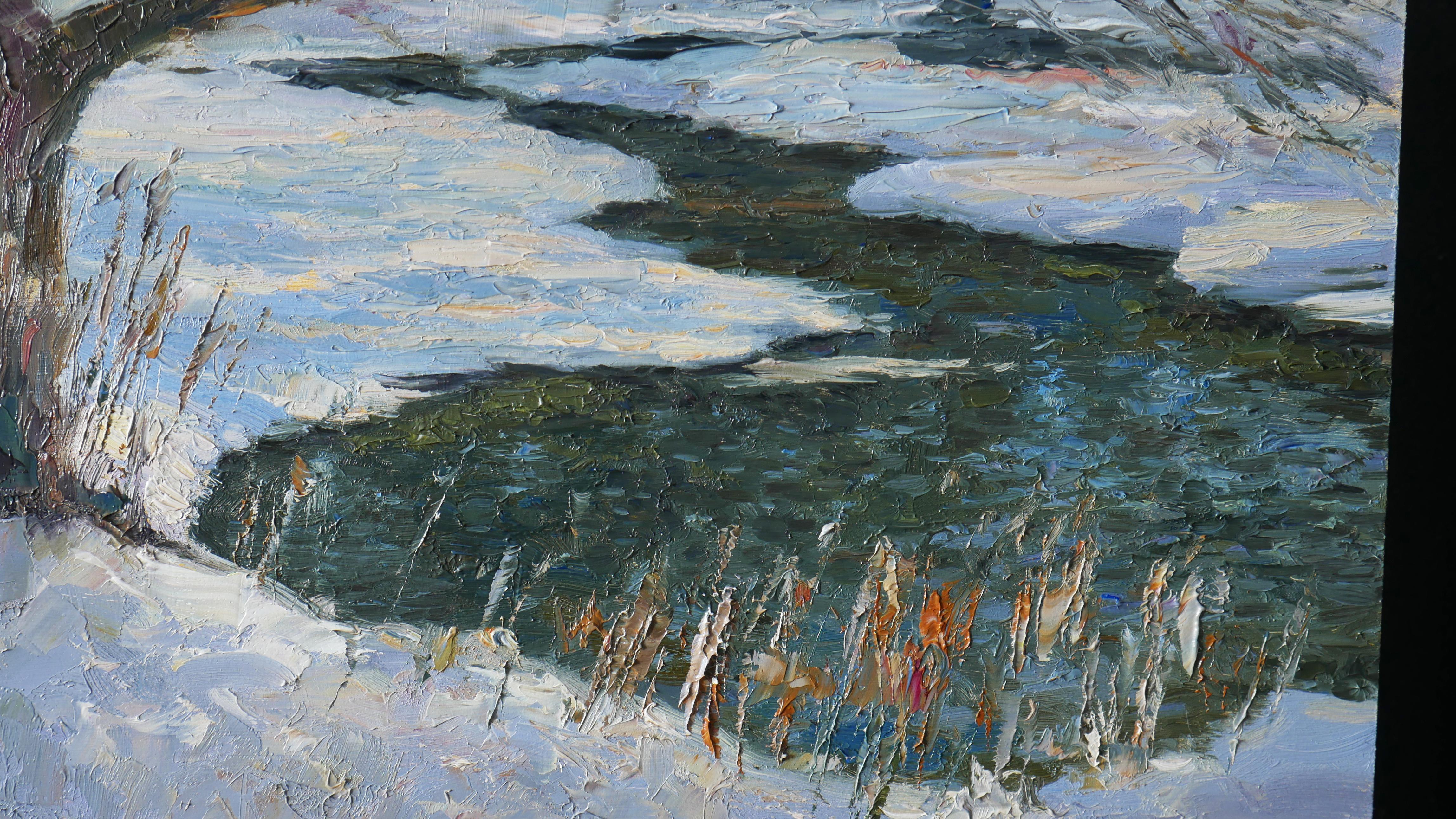 The winter Sun bathes the landscape in golden light, glinting off the snow-covered ground. The river, partially frozen, weaves through the scene, its icy surface etched with delicate patterns, while open patches shimmer like liquid silver. Frosted