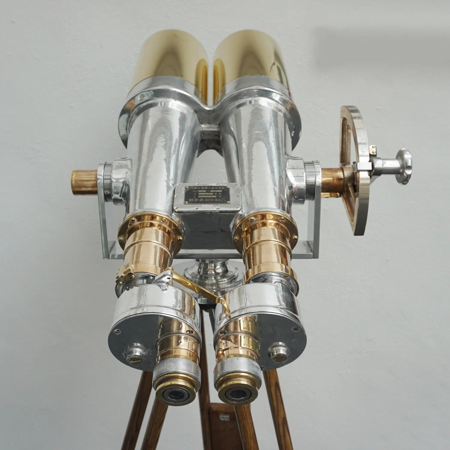 Nikon 20x120 WWII Naval Binoculars in full working order. Chromed metal and brass Binoculars, Set on a later later extending wood and chromed metal stand.

20x magnification with 120mm objective lenses. Paint stripped and metal polished. Optics