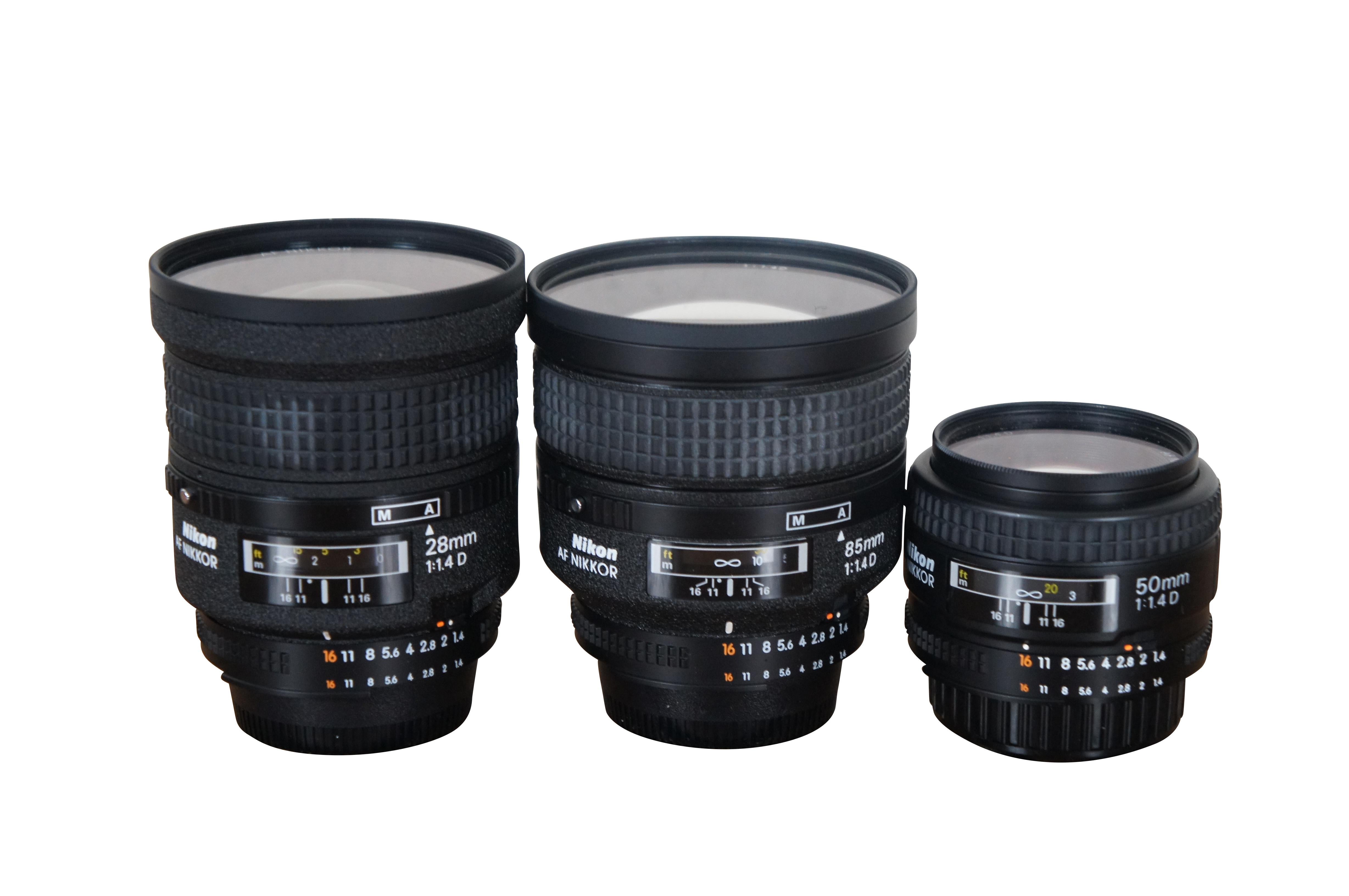 Vintage Nikon camera lens lot.  Comes with Lightware case, 3 Nikon AF Nikkor 1:1.4D lenses (28mm, 85mm, and 50mm), Nikon Speedlight SB-28 flash, 4 Nikon lens hoods (HN-31, HK-&, HN-1, and HR-2 55/1.2 R8), 3 Nikon L37c filters / diffusers (52mm,