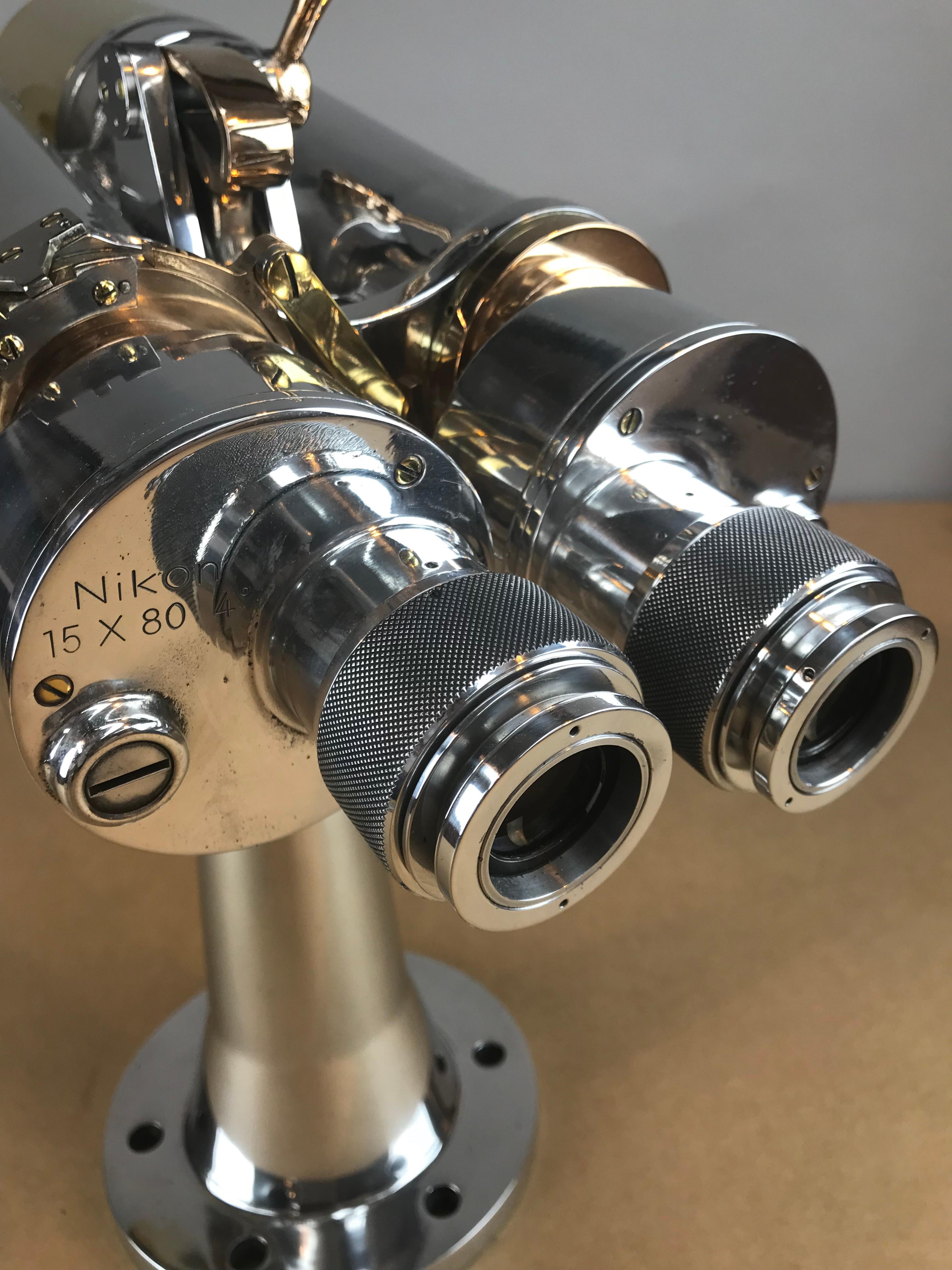 These beautiful Imperial Navy Big Eye binoculars are as practical as they are elegant, with a far-reaching magnification. They are mounted to an original base which can be fixed on the Deck of a Yacht or a metal polished tripod. Superb working