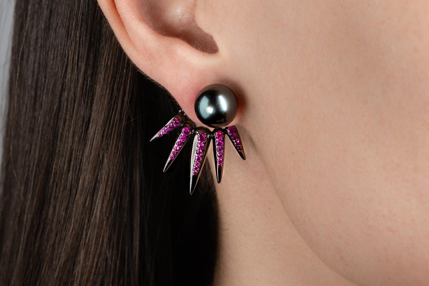 These Exquisite Jacket Earrings designed by Nikos Koulis and his characteristic Spectrum collection feature 1,25 carats of rubies, black pearl & black rhodium. Can be worn as a set or with several combinations composing a fascinating pair of
