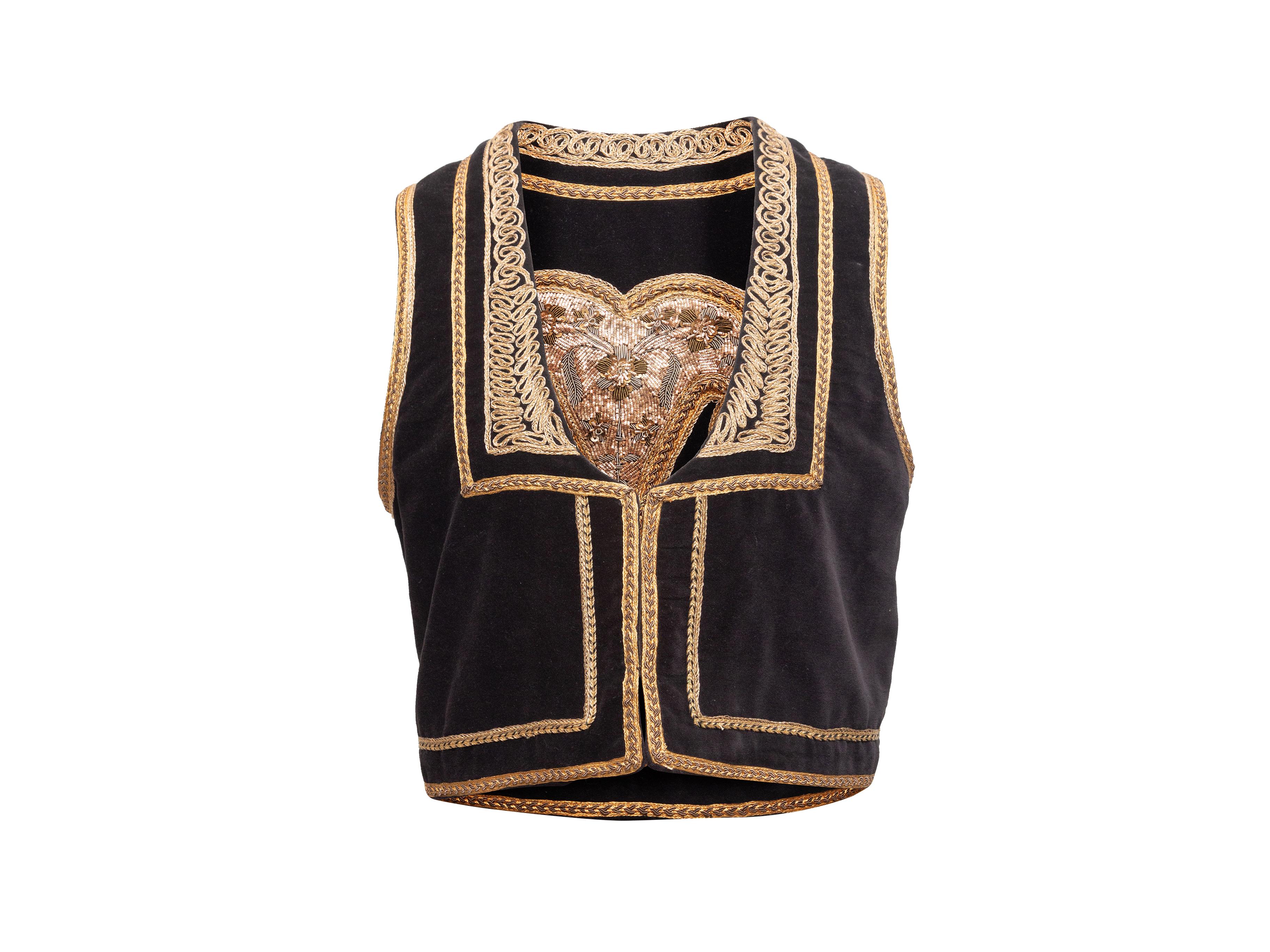 Product details: Black velvet vest by Nili Lotan. Metallic gold embroidery throughout. Scoop neck. Pointed collar. Hook-and-eye closures at front. 37